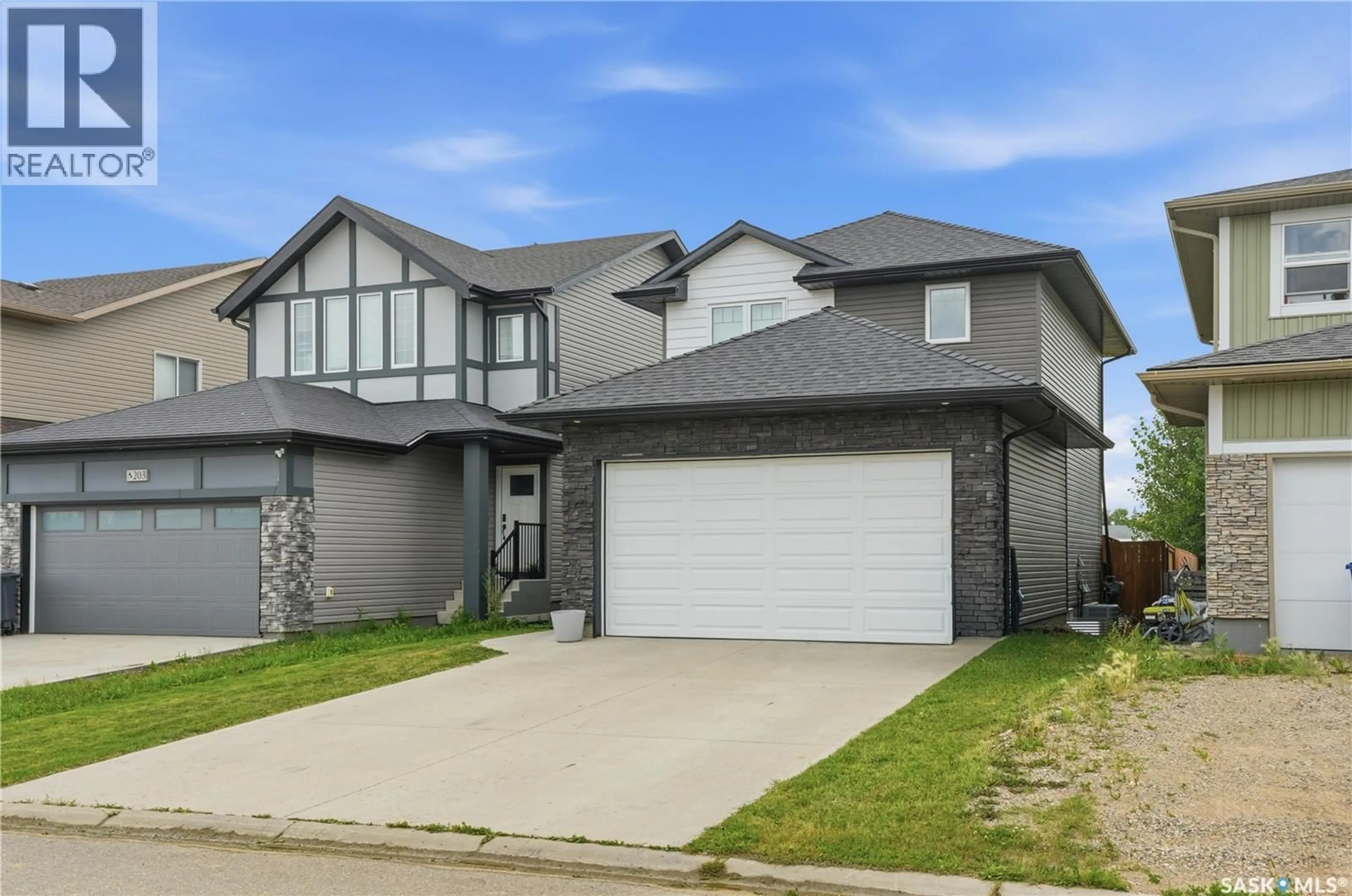 Home with brick exterior material, street for 205 WALL STREET, Dalmeny Saskatchewan S0K1E0