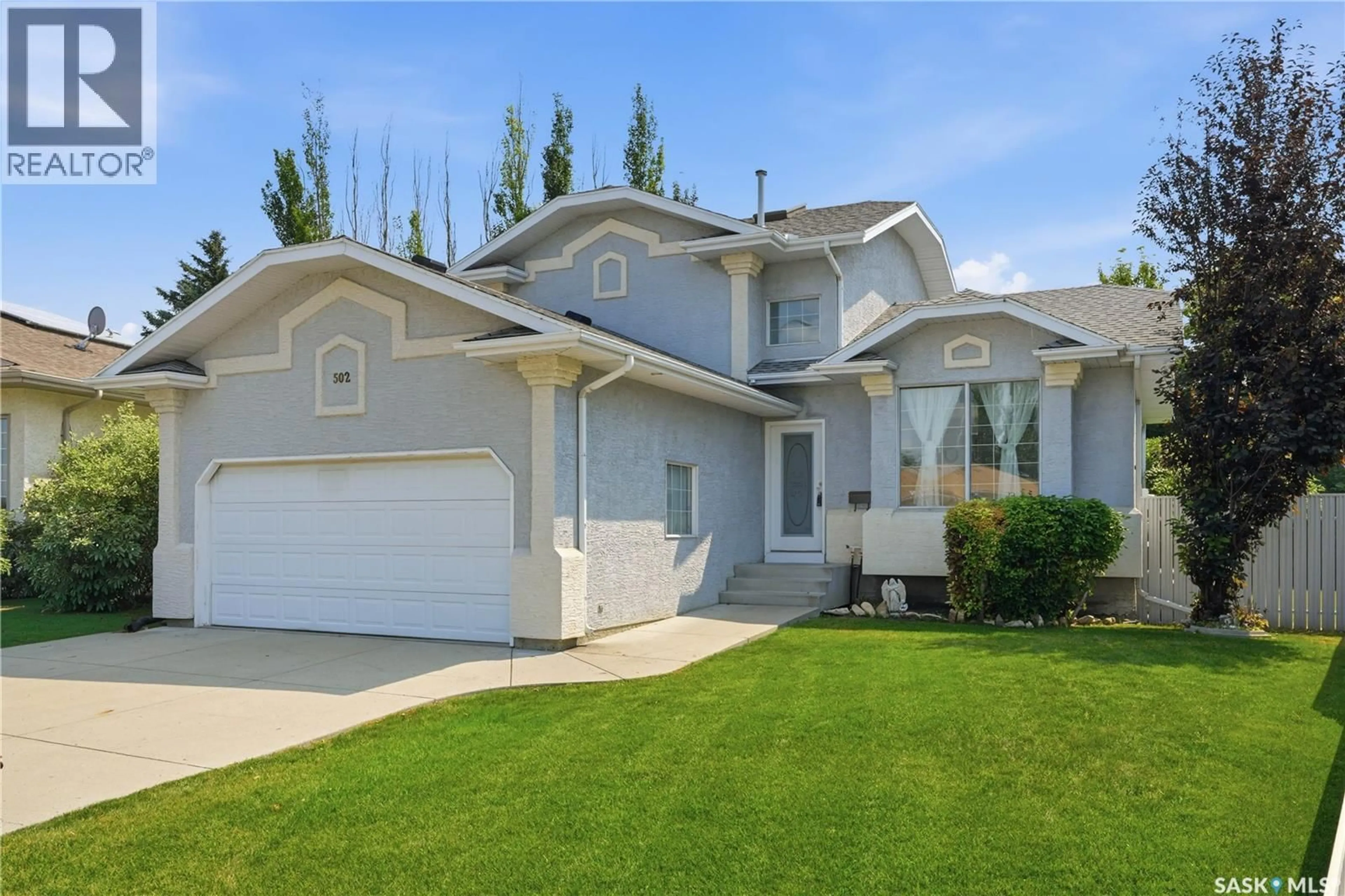 Home with vinyl exterior material, street for 502 SCISSONS CRESCENT, Saskatoon Saskatchewan S7S1C2