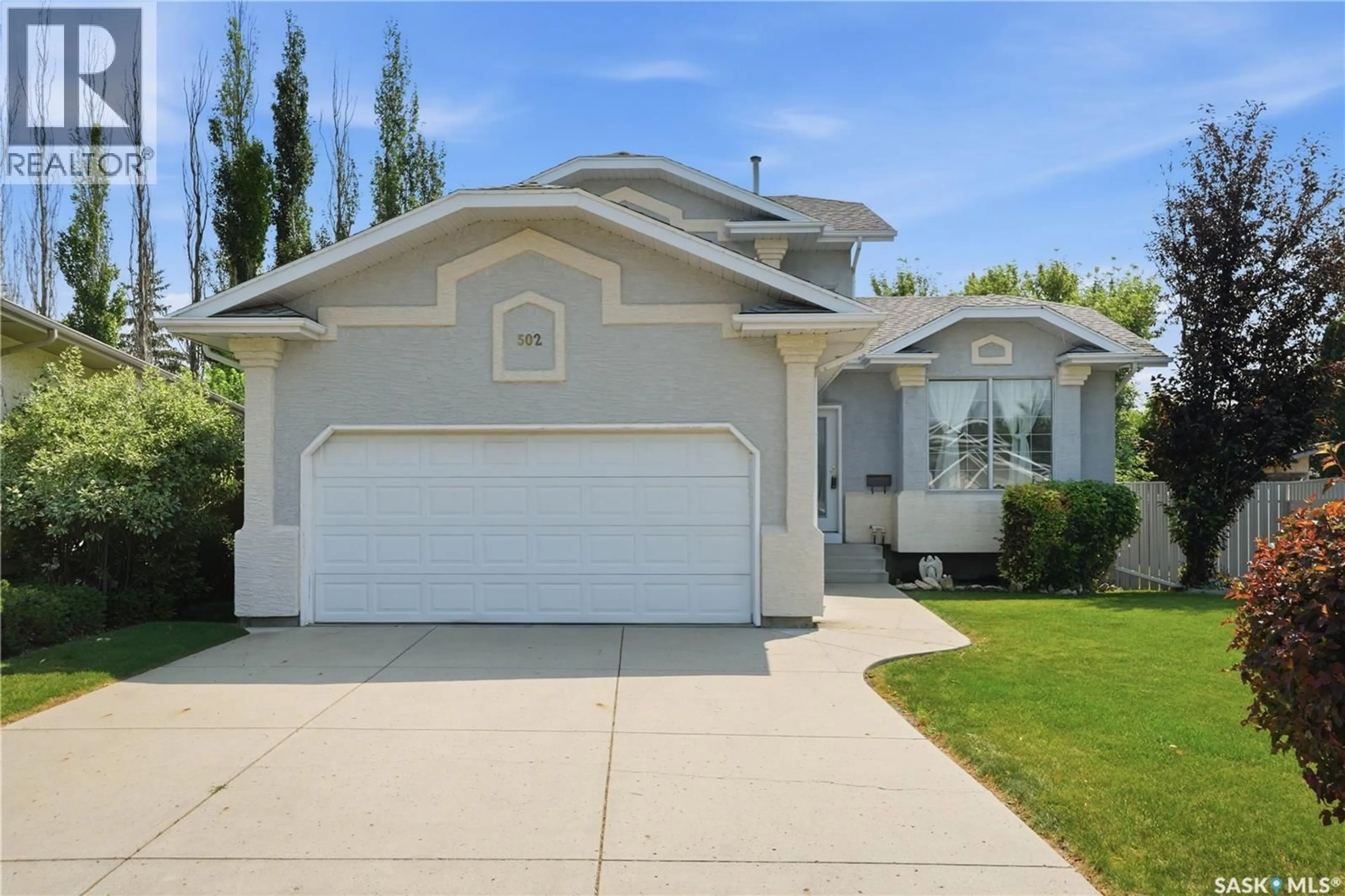 Home with vinyl exterior material, street for 502 SCISSONS CRESCENT, Saskatoon Saskatchewan S7S1C2