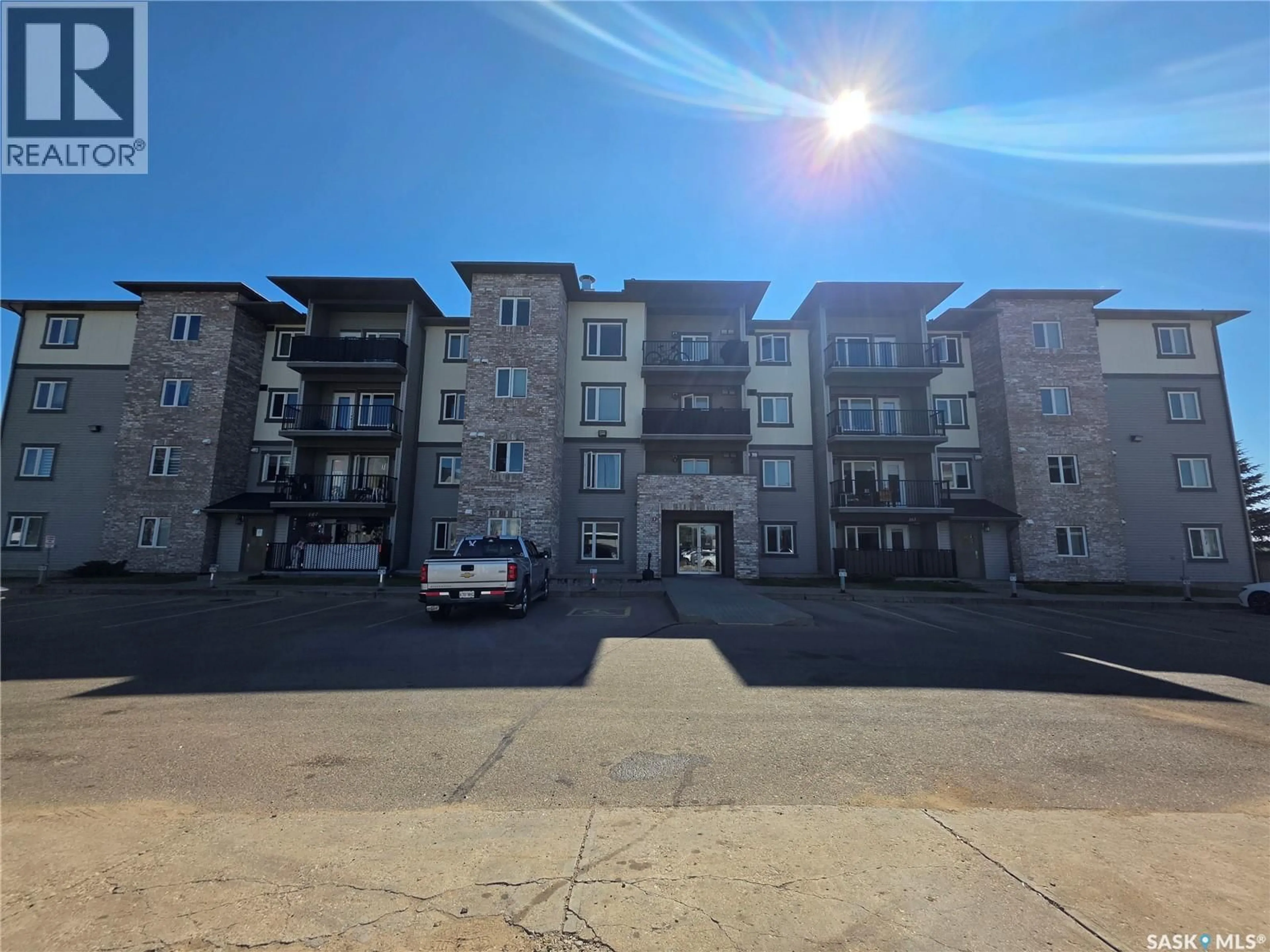 A pic from outside/outdoor area/front of a property/back of a property/a pic from drone, unknown for 306 - 110 PETTERSON DRIVE, Estevan Saskatchewan S4A2A8