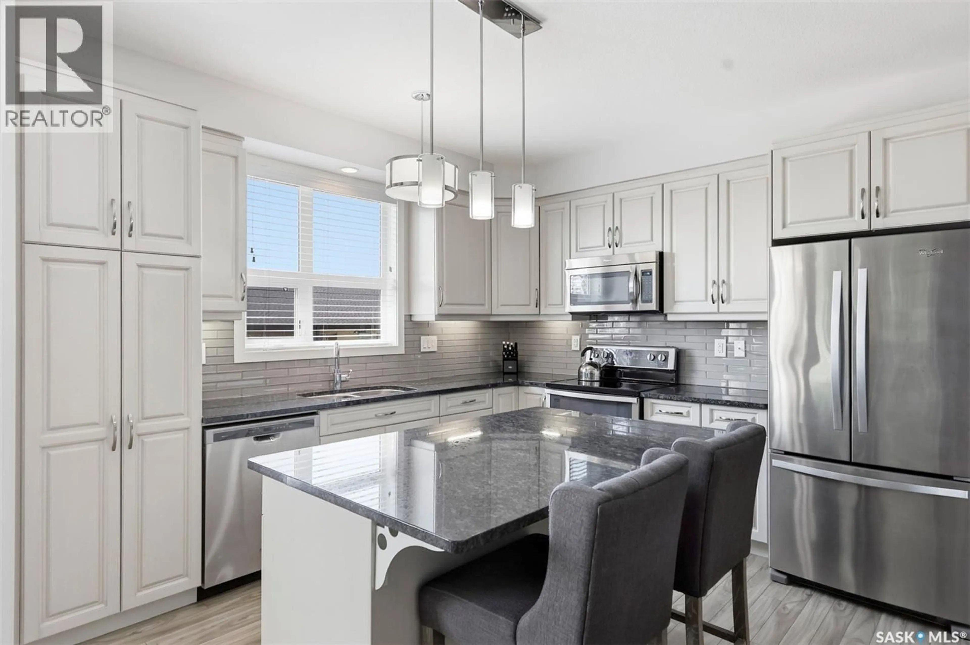 Open concept kitchen, ceramic/tile floor for 1025 - 310 MOSS AVENUE, Saskatoon Saskatchewan S7H4C7