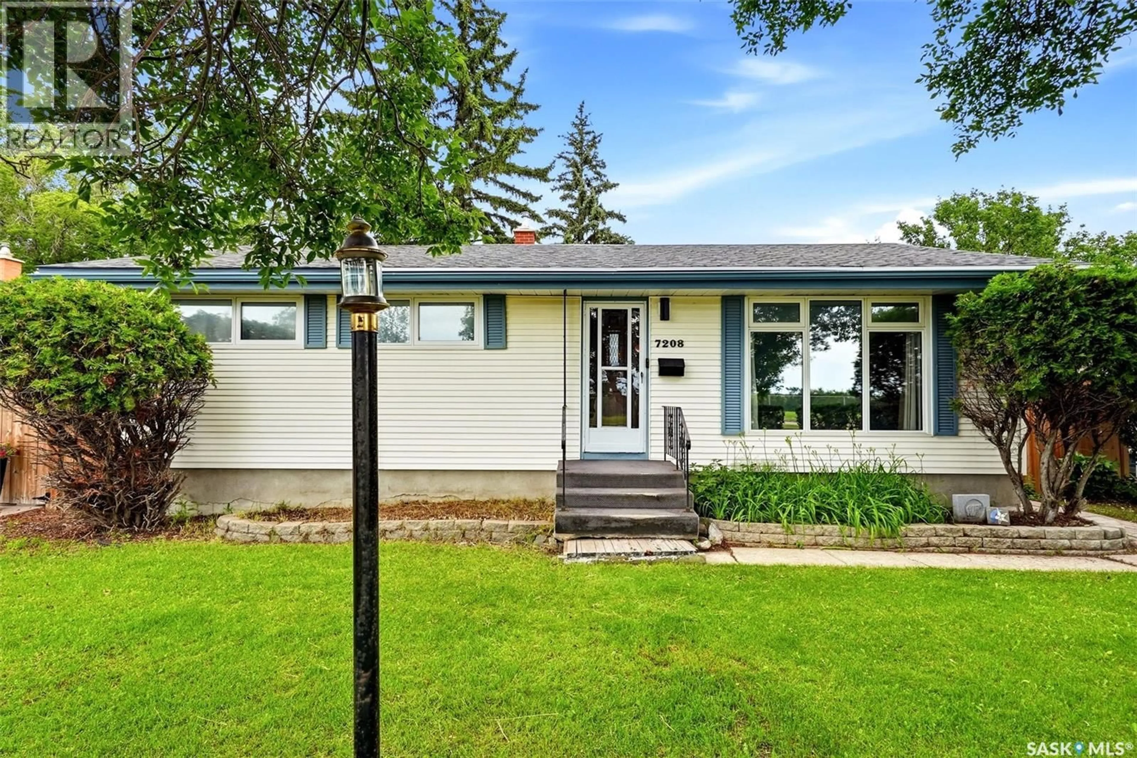 Home with vinyl exterior material, street for 7208 DEWDNEY AVENUE, Regina Saskatchewan S4T1E6