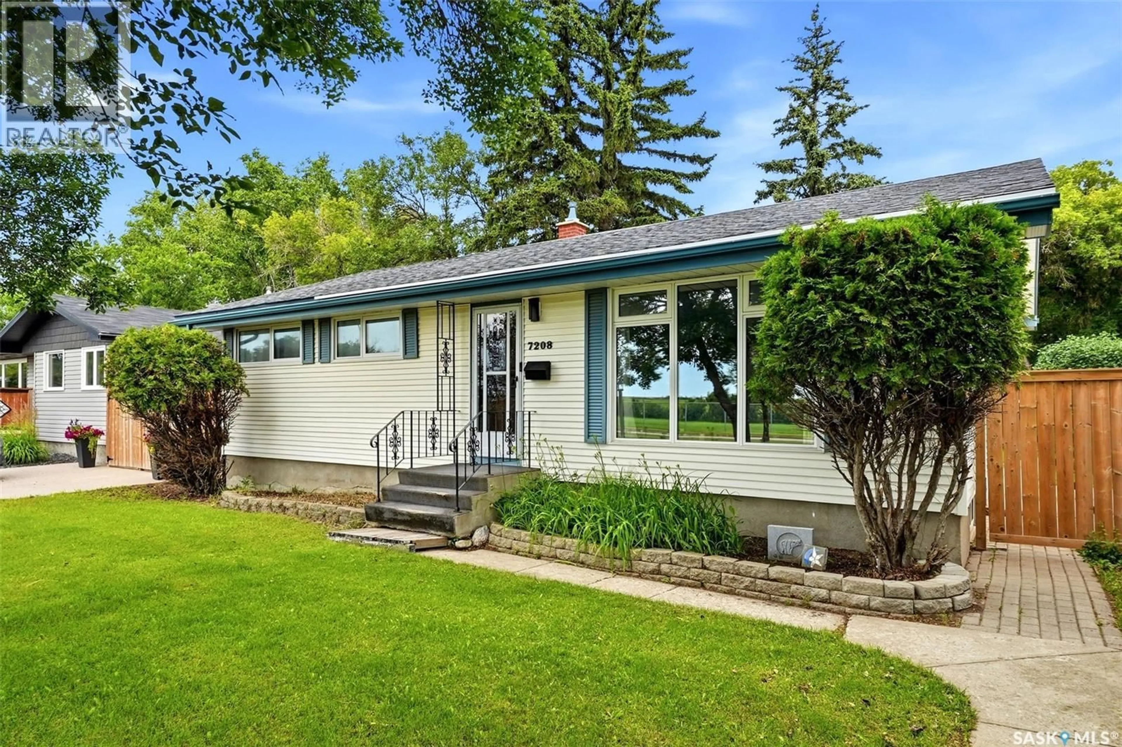 Home with vinyl exterior material, street for 7208 DEWDNEY AVENUE, Regina Saskatchewan S4T1E6
