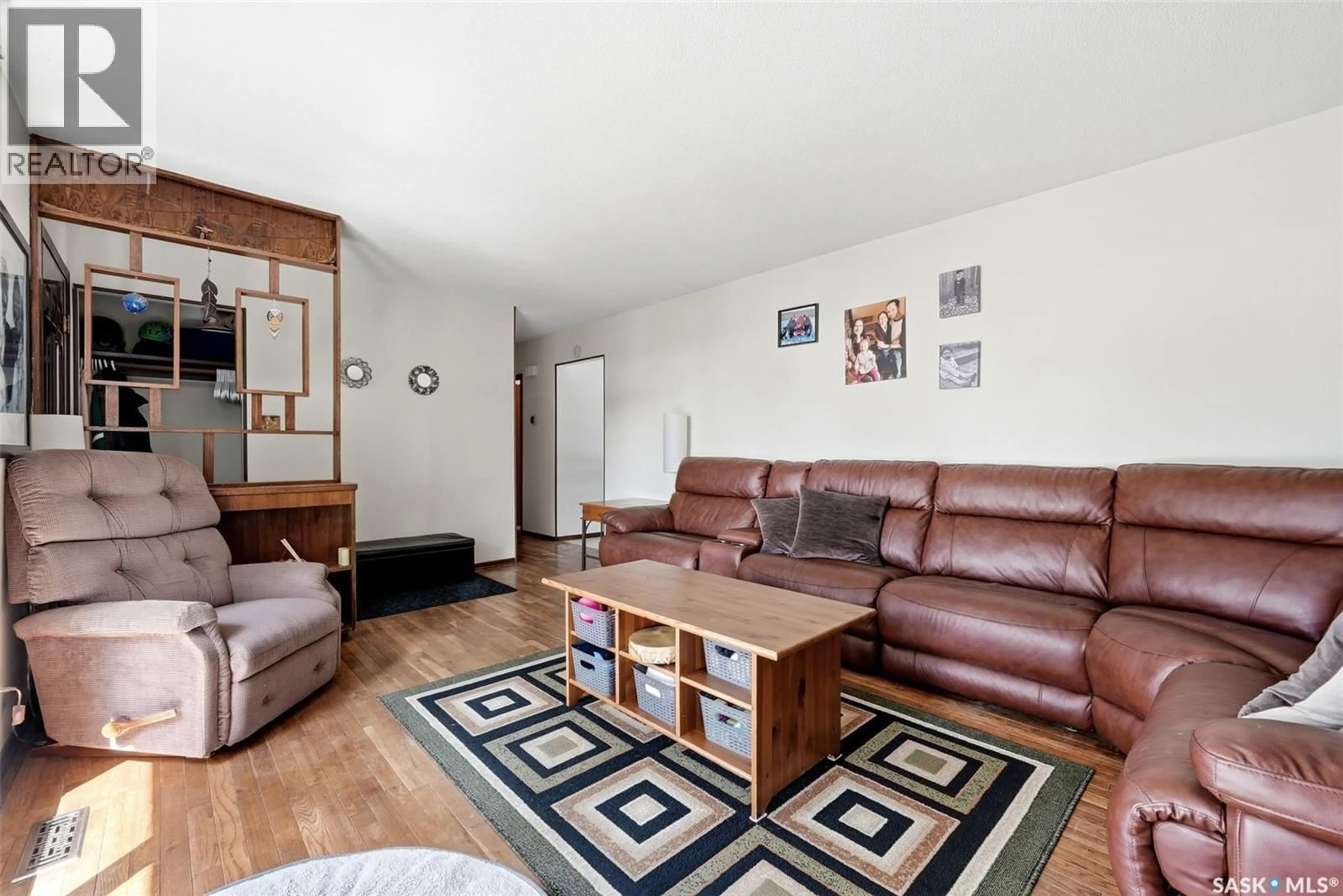 Living room with furniture, wood/laminate floor for 7208 DEWDNEY AVENUE, Regina Saskatchewan S4T1E6