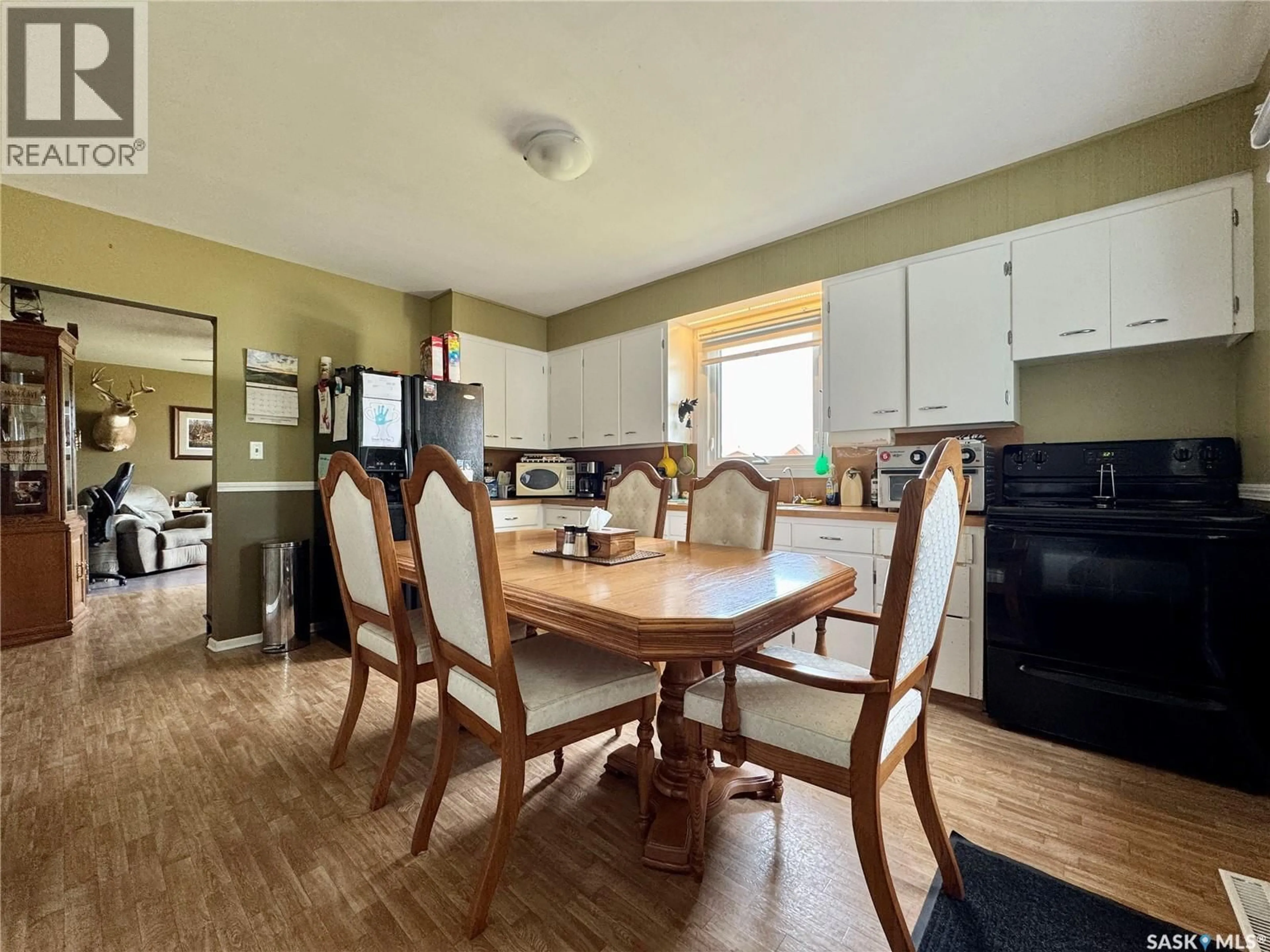 Dining room, wood/laminate floor for 321 VINCENT AVENUE, Churchbridge Saskatchewan S0A0M0