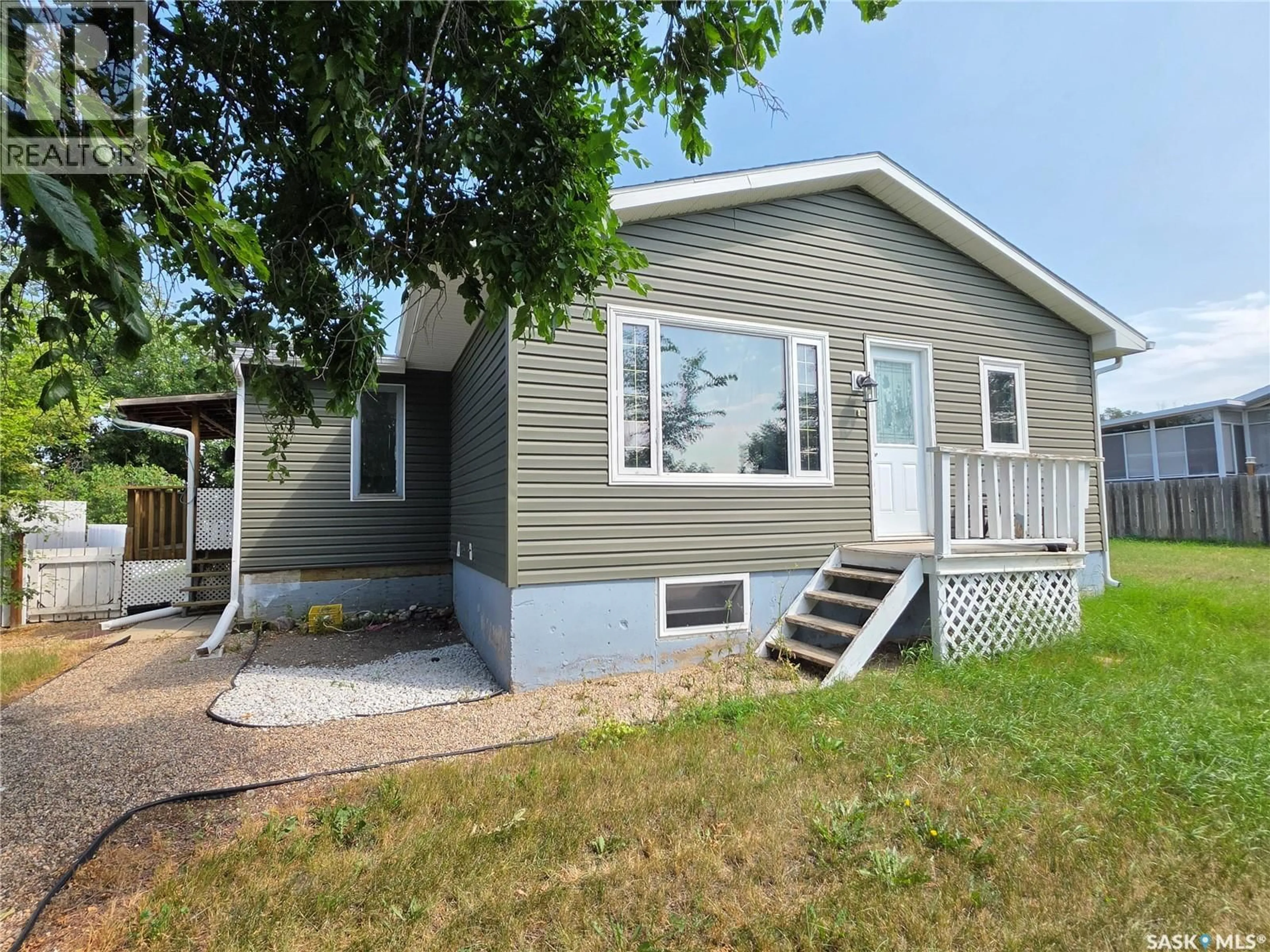 Home with vinyl exterior material, street for 1119 CHAPLIN STREET, Swift Current Saskatchewan S9H1J9
