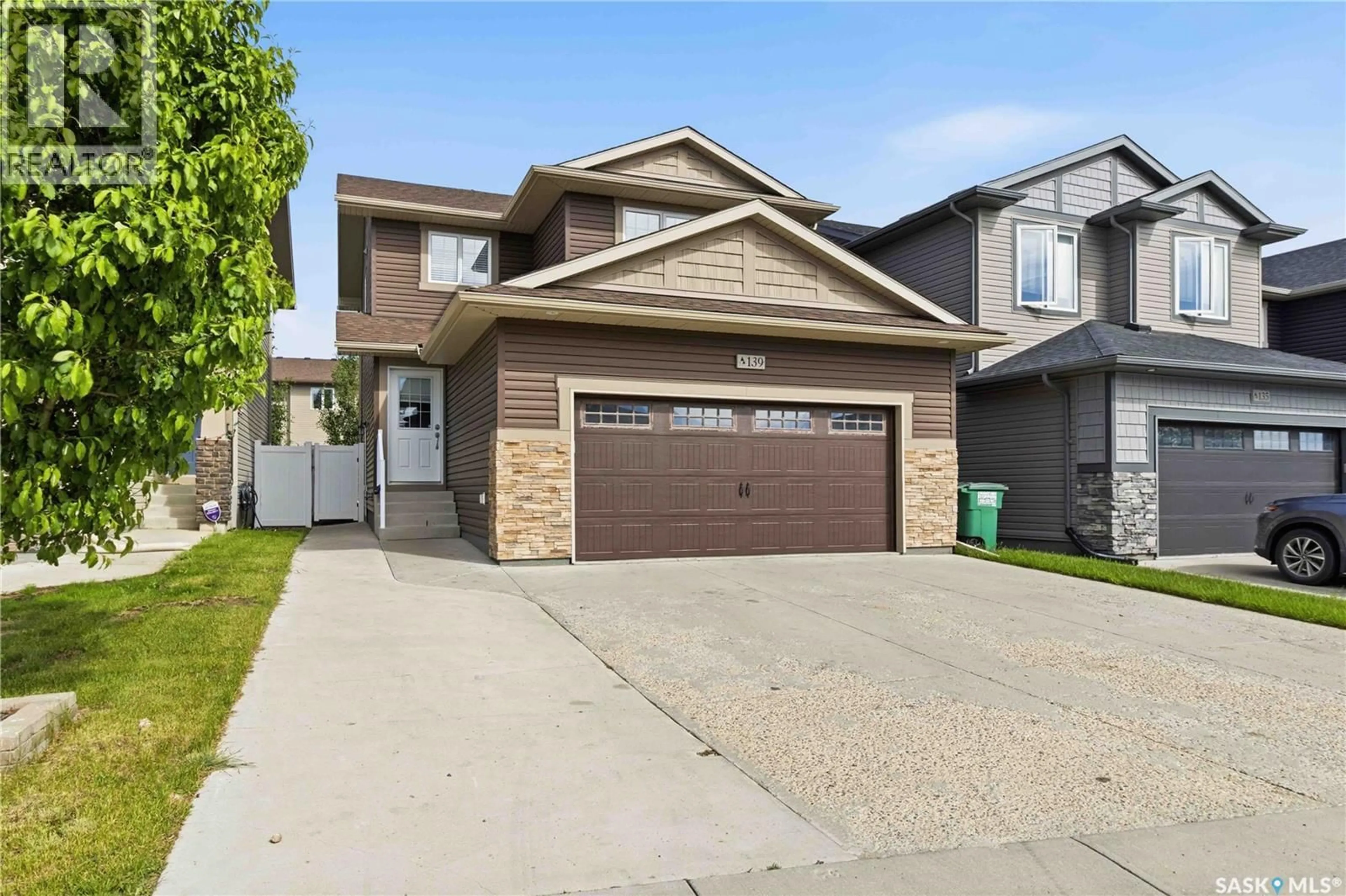Home with vinyl exterior material, street for 139 DAGNONE LANE, Saskatoon Saskatchewan S7V0P6