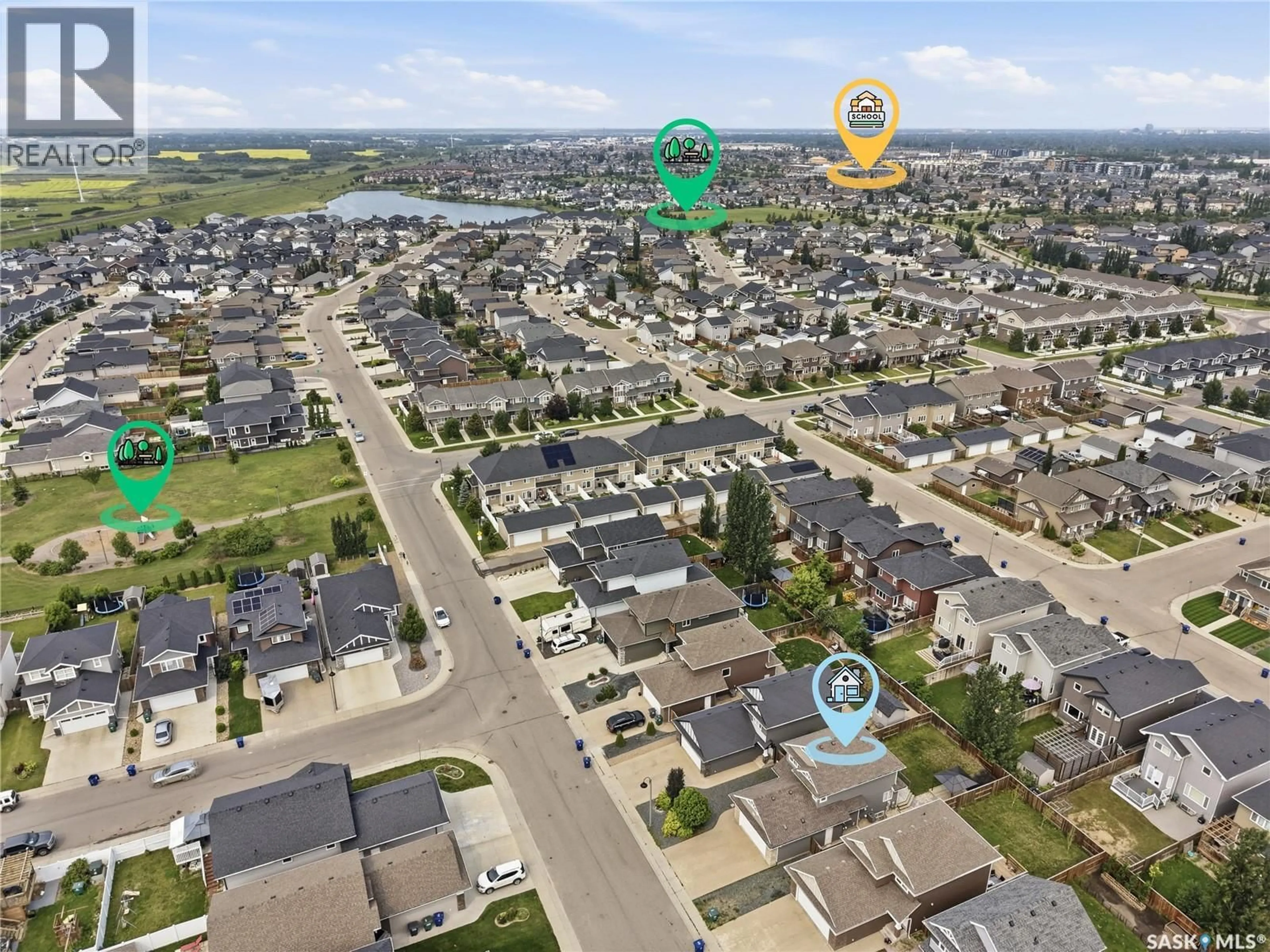 A pic from outside/outdoor area/front of a property/back of a property/a pic from drone, street for 207 KOLYNCHUK MANOR, Saskatoon Saskatchewan S7T0W4