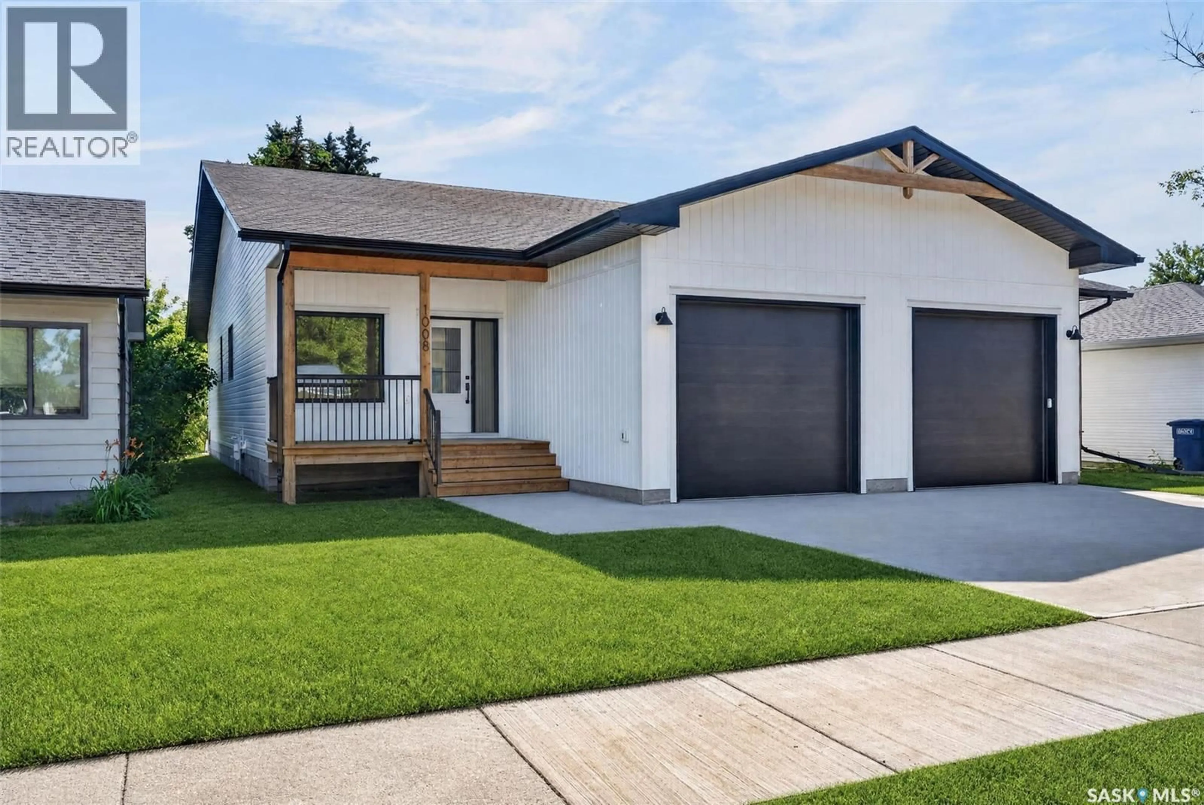 Home with vinyl exterior material, street for 1008 10TH STREET, Humboldt Saskatchewan S0K2A0