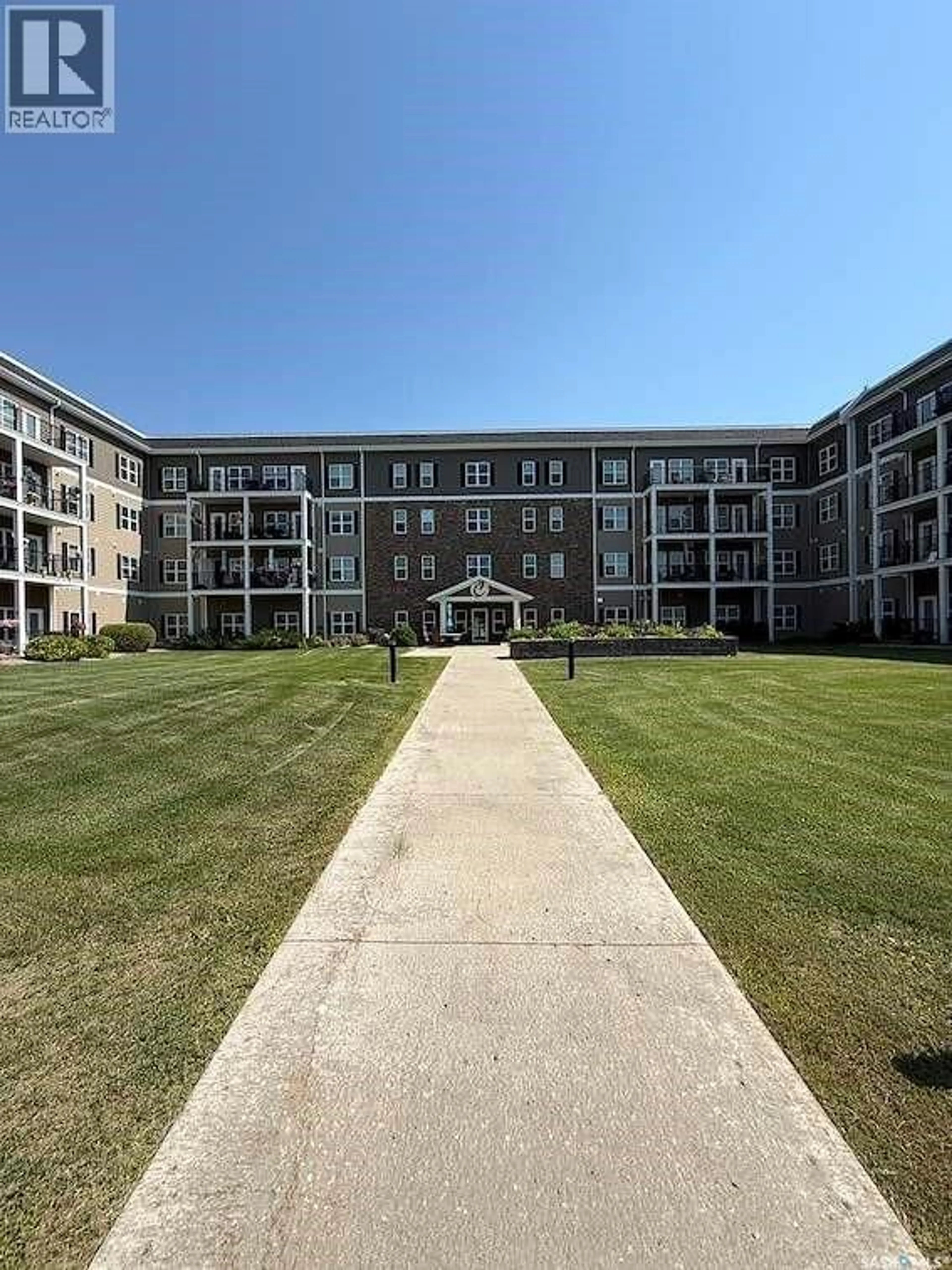 A pic from outside/outdoor area/front of a property/back of a property/a pic from drone, building for 8 - 1802 106TH STREET, North Battleford Saskatchewan S6H3N8