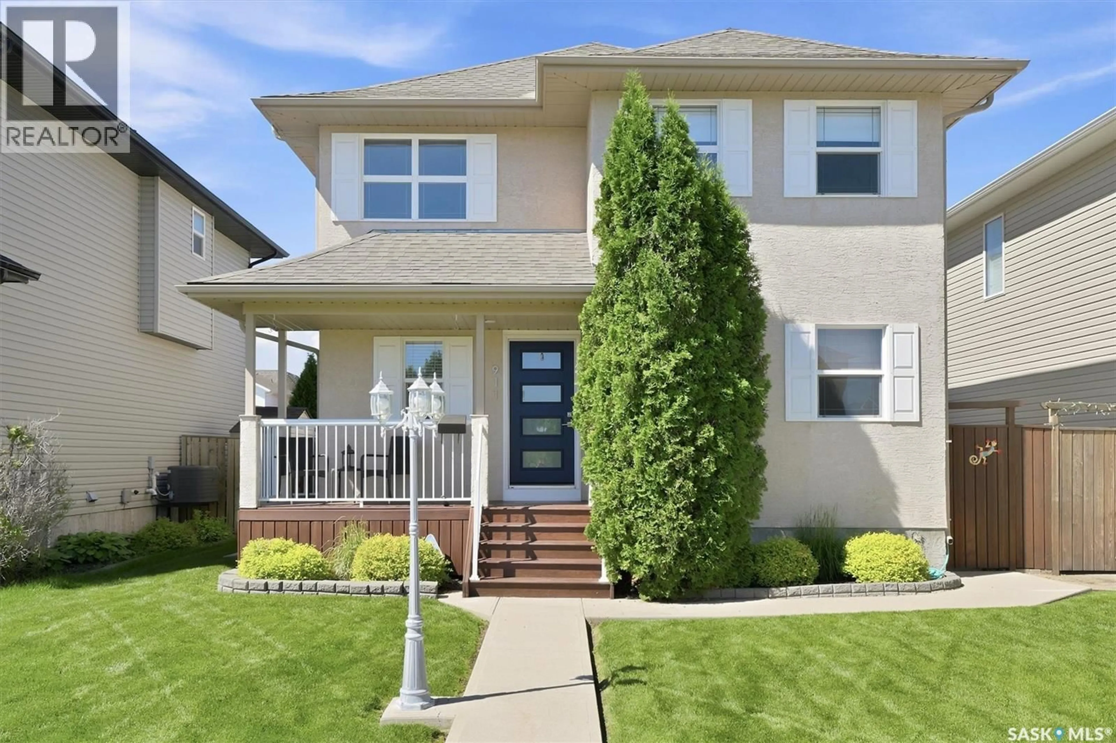 Home with vinyl exterior material, street for 911 MAGUIRE CRESCENT, Saskatoon Saskatchewan S7W1A5