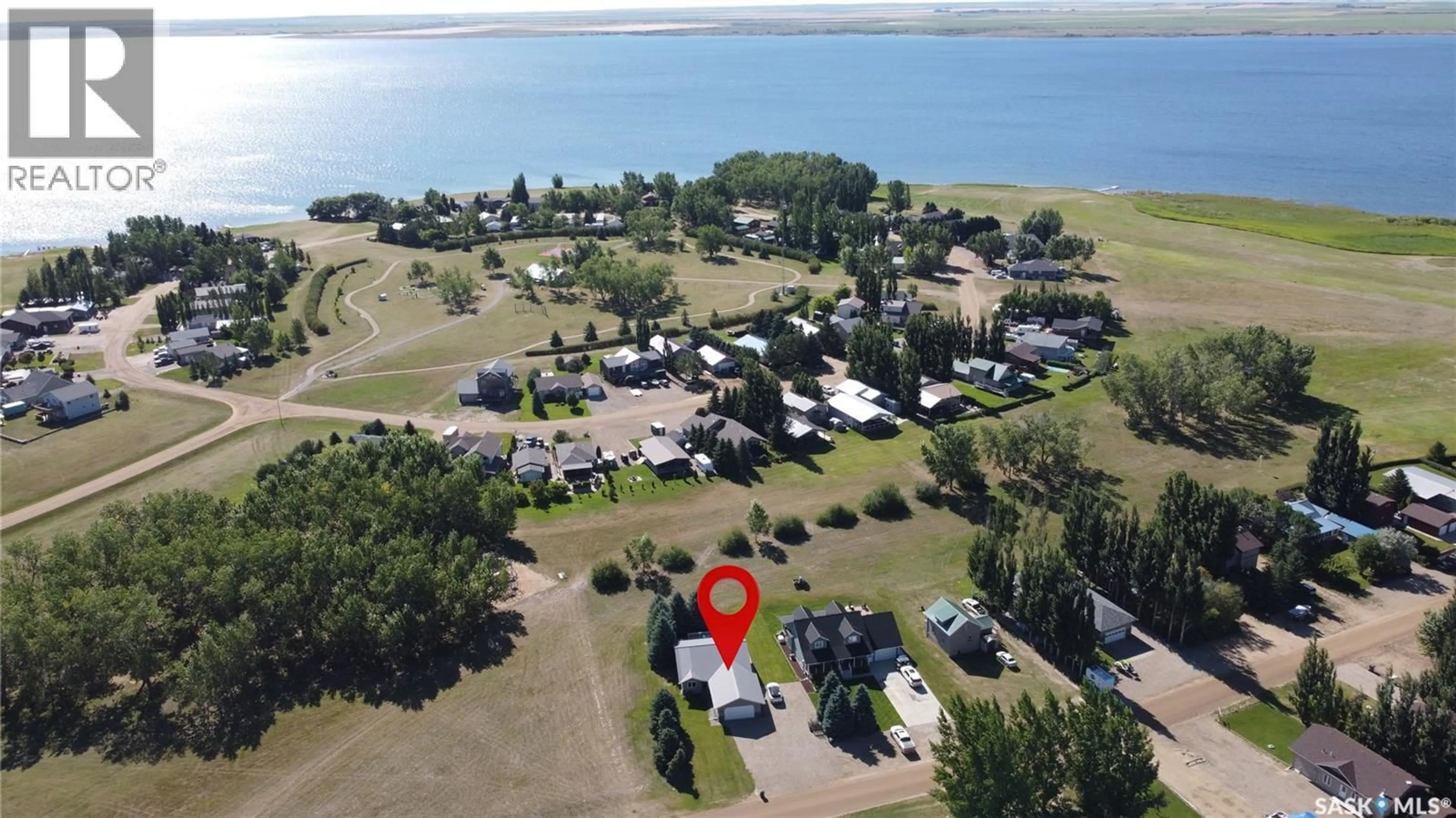 A pic from outside/outdoor area/front of a property/back of a property/a pic from drone, water/lake/river/ocean view for 401 VIVIAN BAY, Coteau Rm No. 255 Saskatchewan S0L0G0