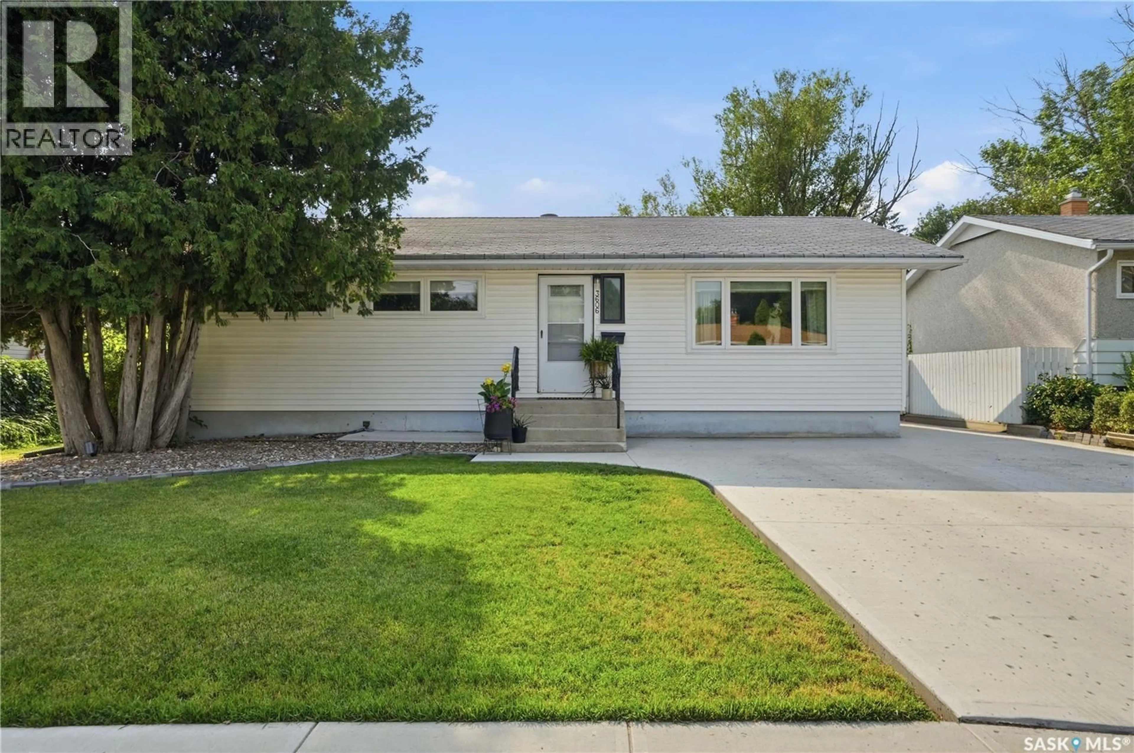Home with vinyl exterior material, street for 3606 QUEEN STREET, Regina Saskatchewan S4S2G3