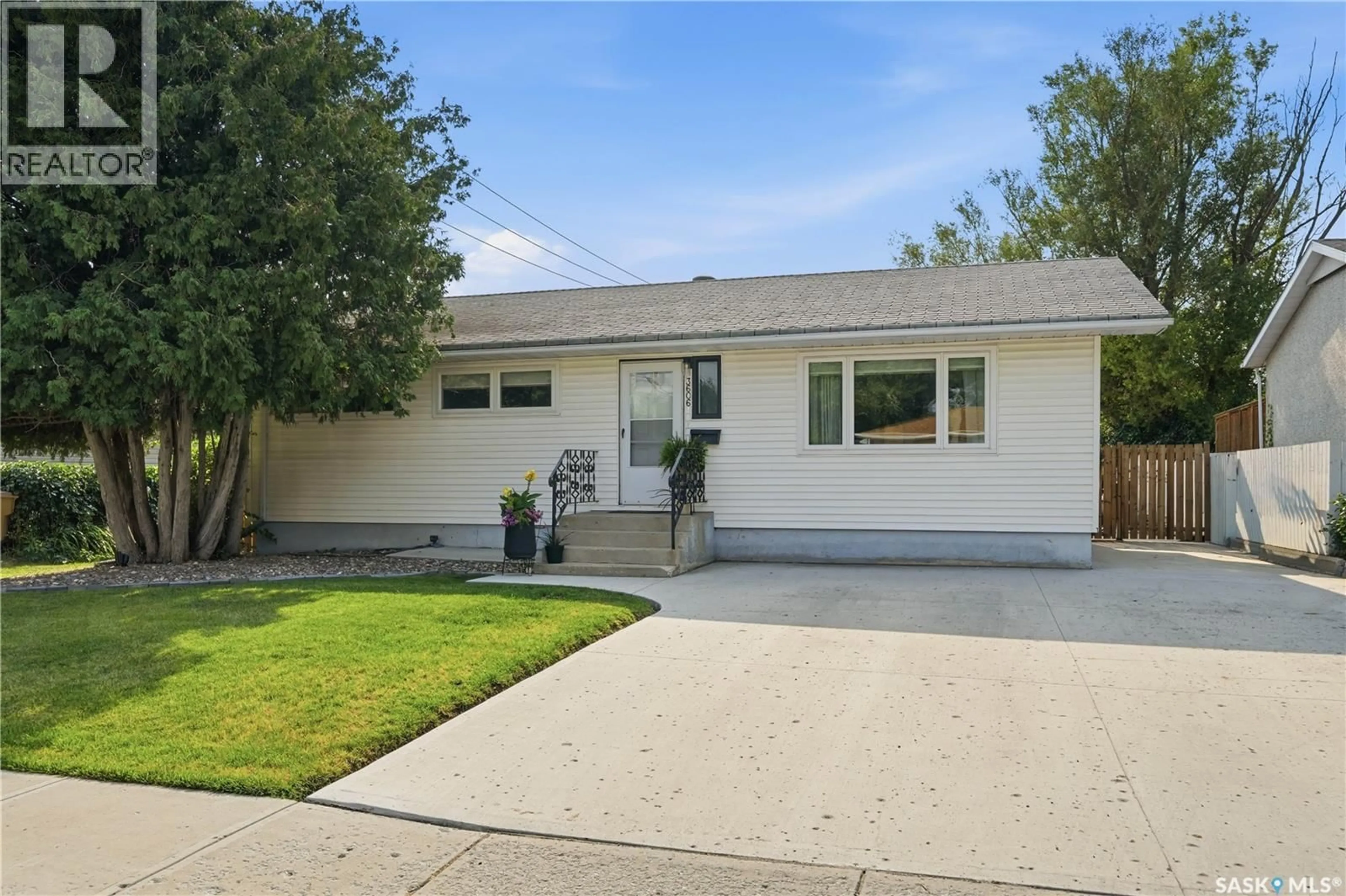 Home with vinyl exterior material, street for 3606 QUEEN STREET, Regina Saskatchewan S4S2G3