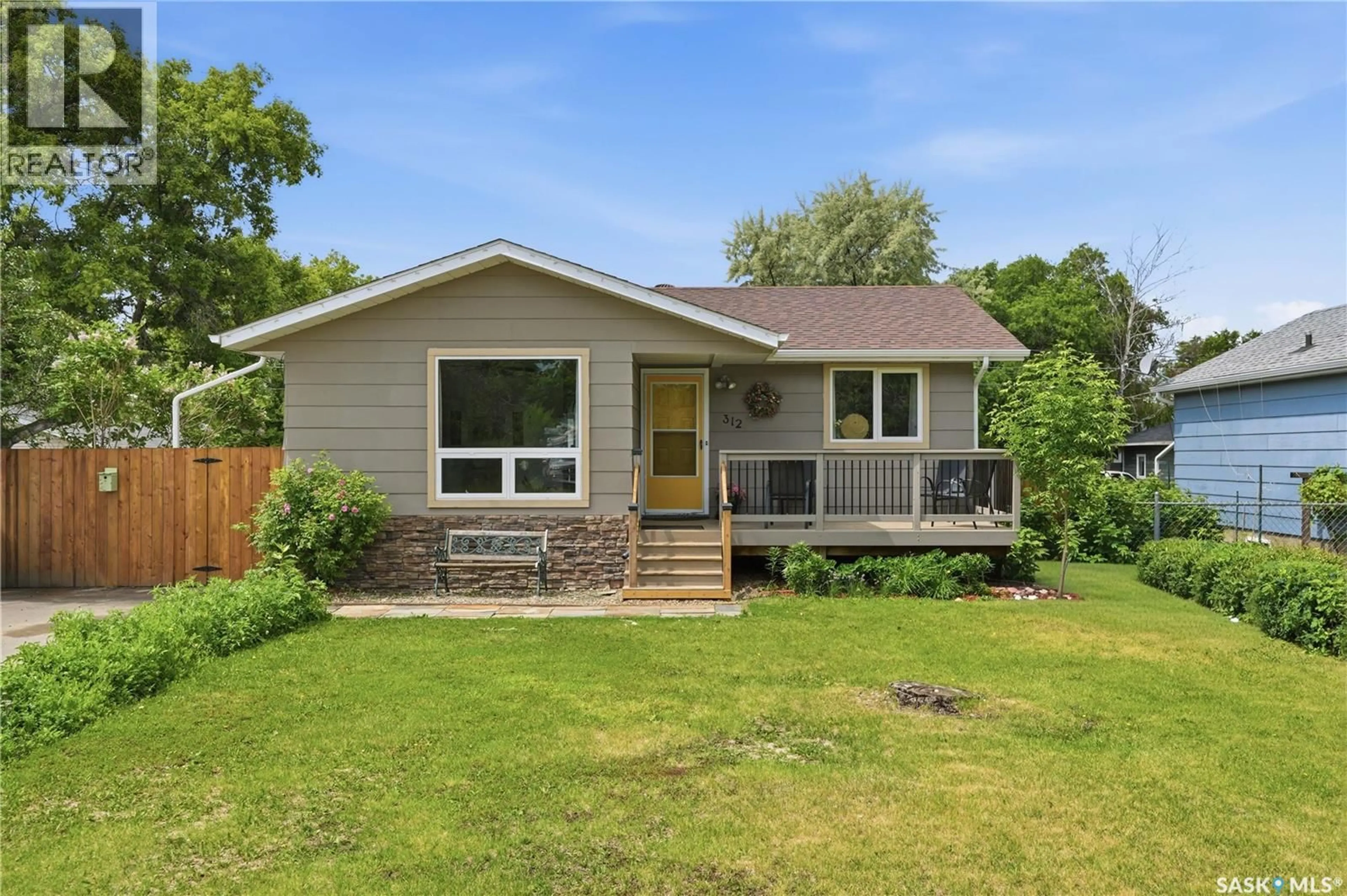 Home with vinyl exterior material, street for 312 ASH STREET, Outlook Saskatchewan S0L2N0