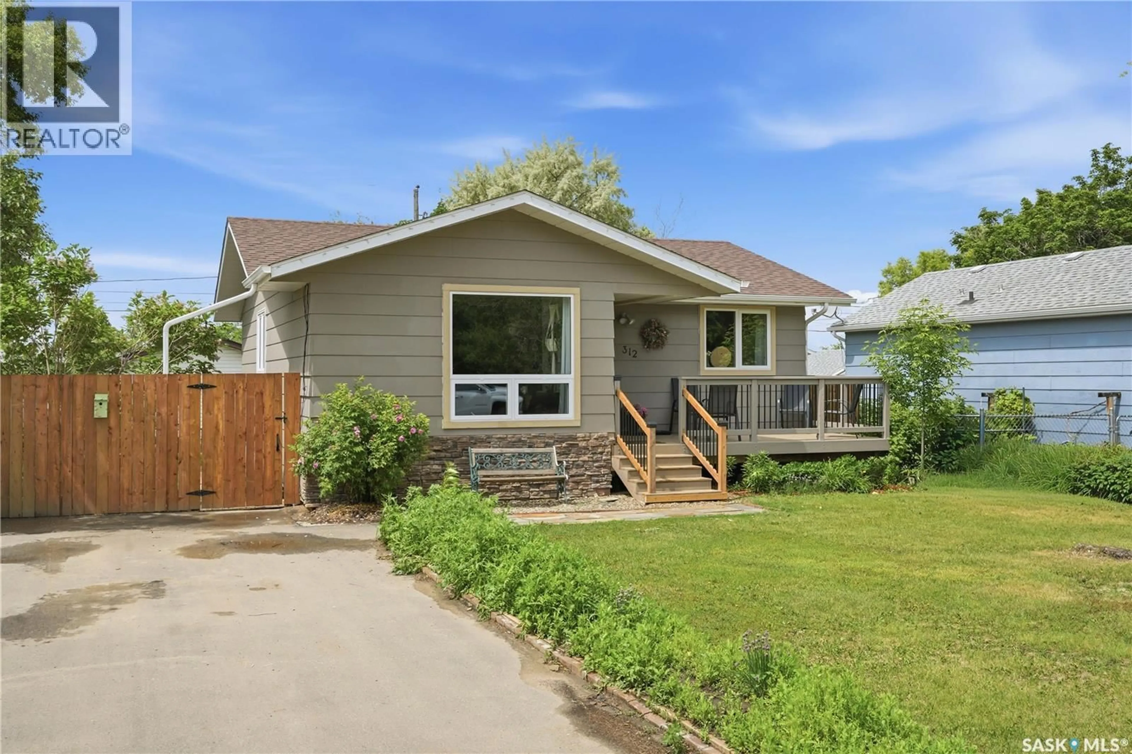 Home with vinyl exterior material, street for 312 ASH STREET, Outlook Saskatchewan S0L2N0