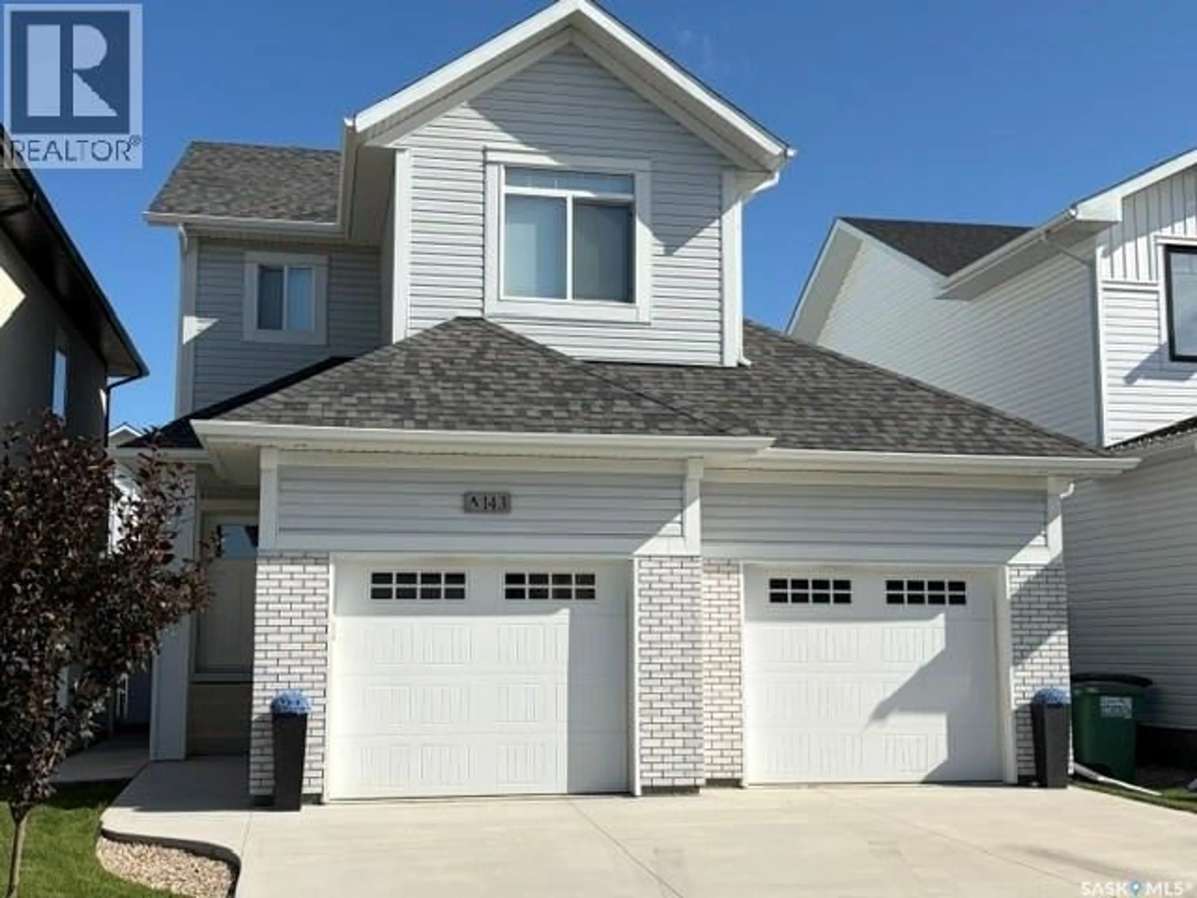 Home with vinyl exterior material, street for 143 BARRETT STREET, Saskatoon Saskatchewan S7W0Z8