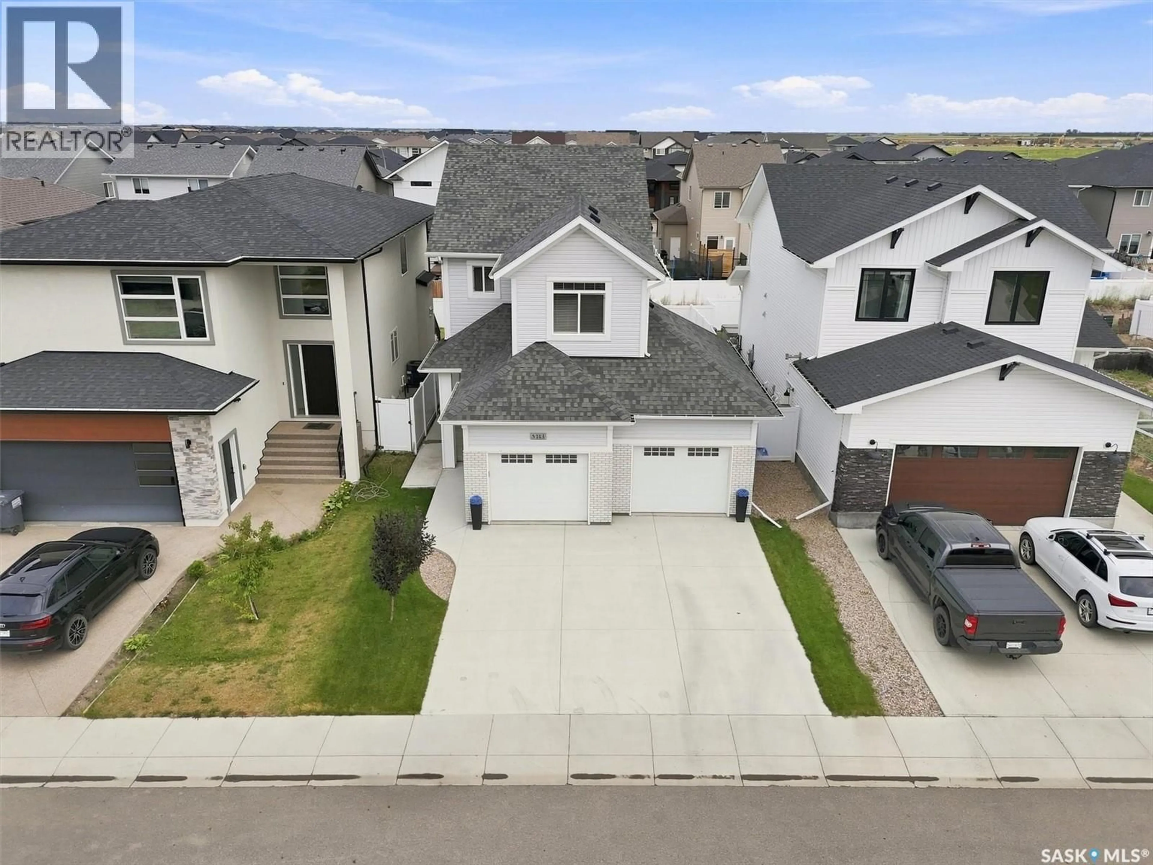 A pic from outside/outdoor area/front of a property/back of a property/a pic from drone, street for 143 BARRETT STREET, Saskatoon Saskatchewan S7W0Z8