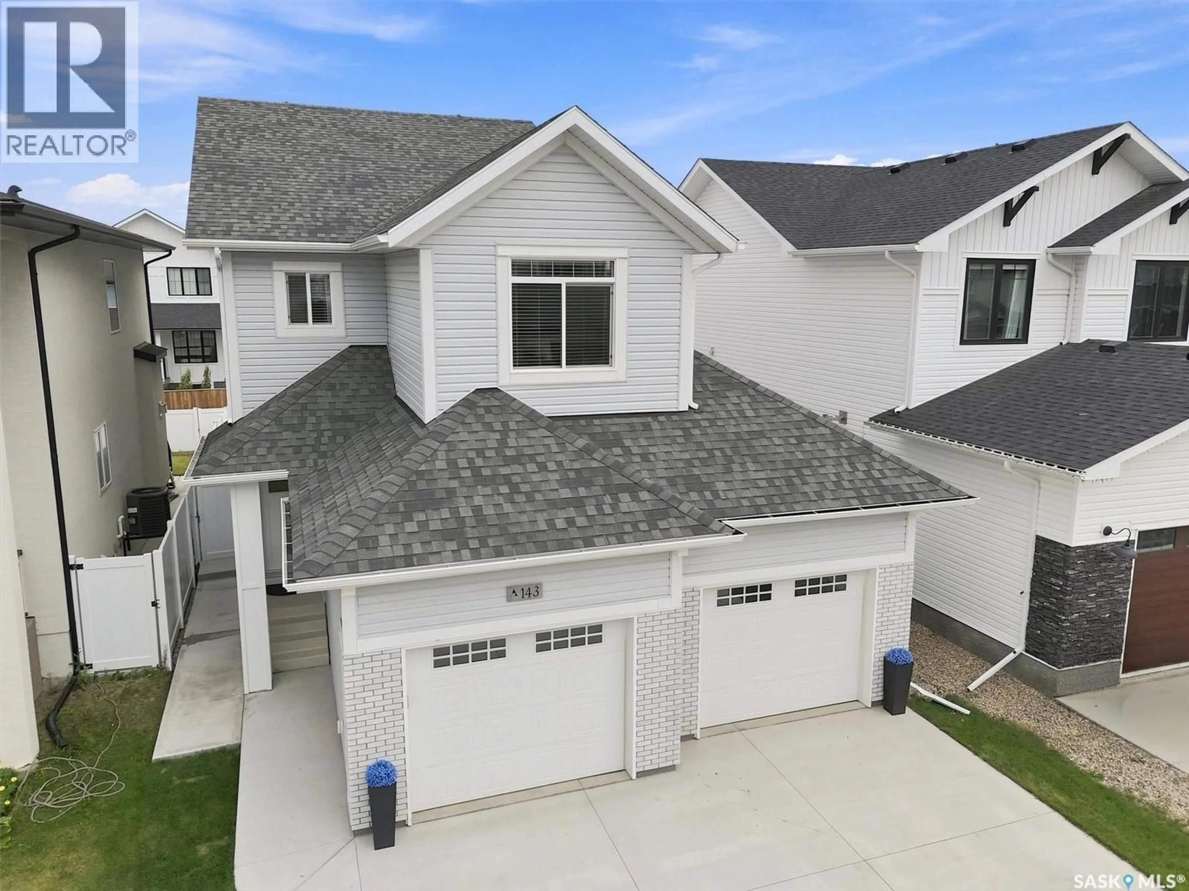Home with vinyl exterior material, street for 143 BARRETT STREET, Saskatoon Saskatchewan S7W0Z8