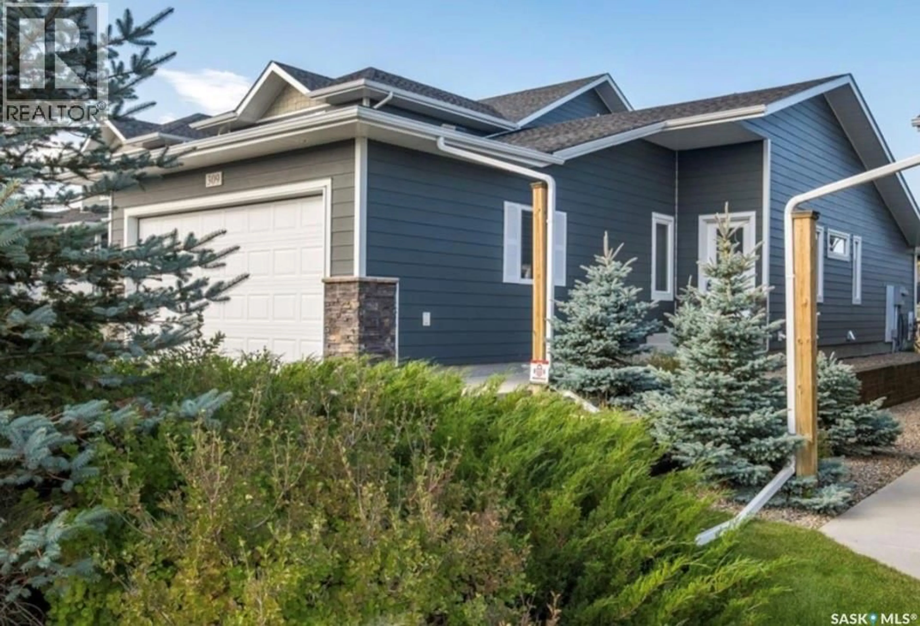 Home with vinyl exterior material, street for 1851 - 309 PEDERSON DRIVE, Prince Albert Saskatchewan S6X0B2