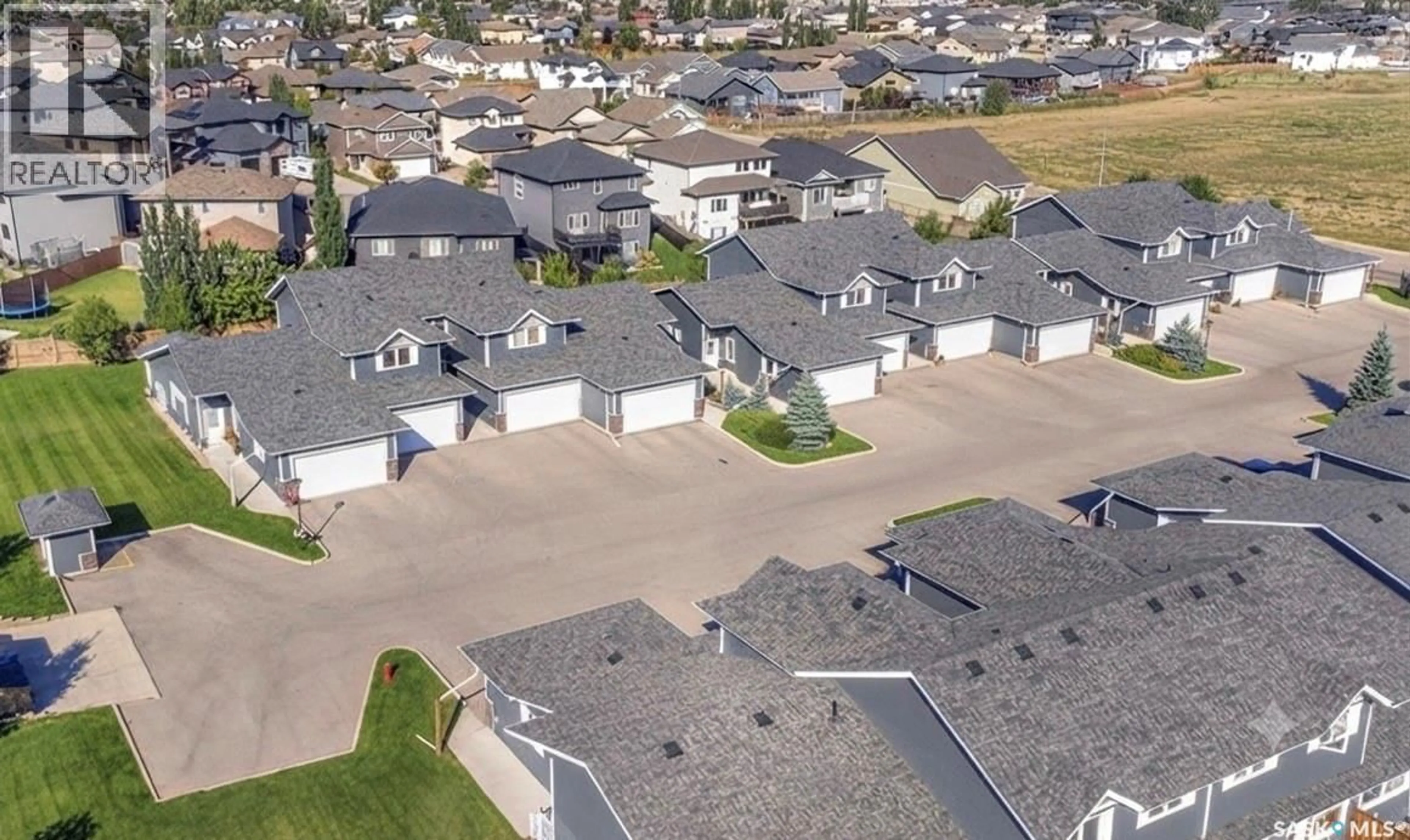 A pic from outside/outdoor area/front of a property/back of a property/a pic from drone, street for 1851 - 309 PEDERSON DRIVE, Prince Albert Saskatchewan S6X0B2