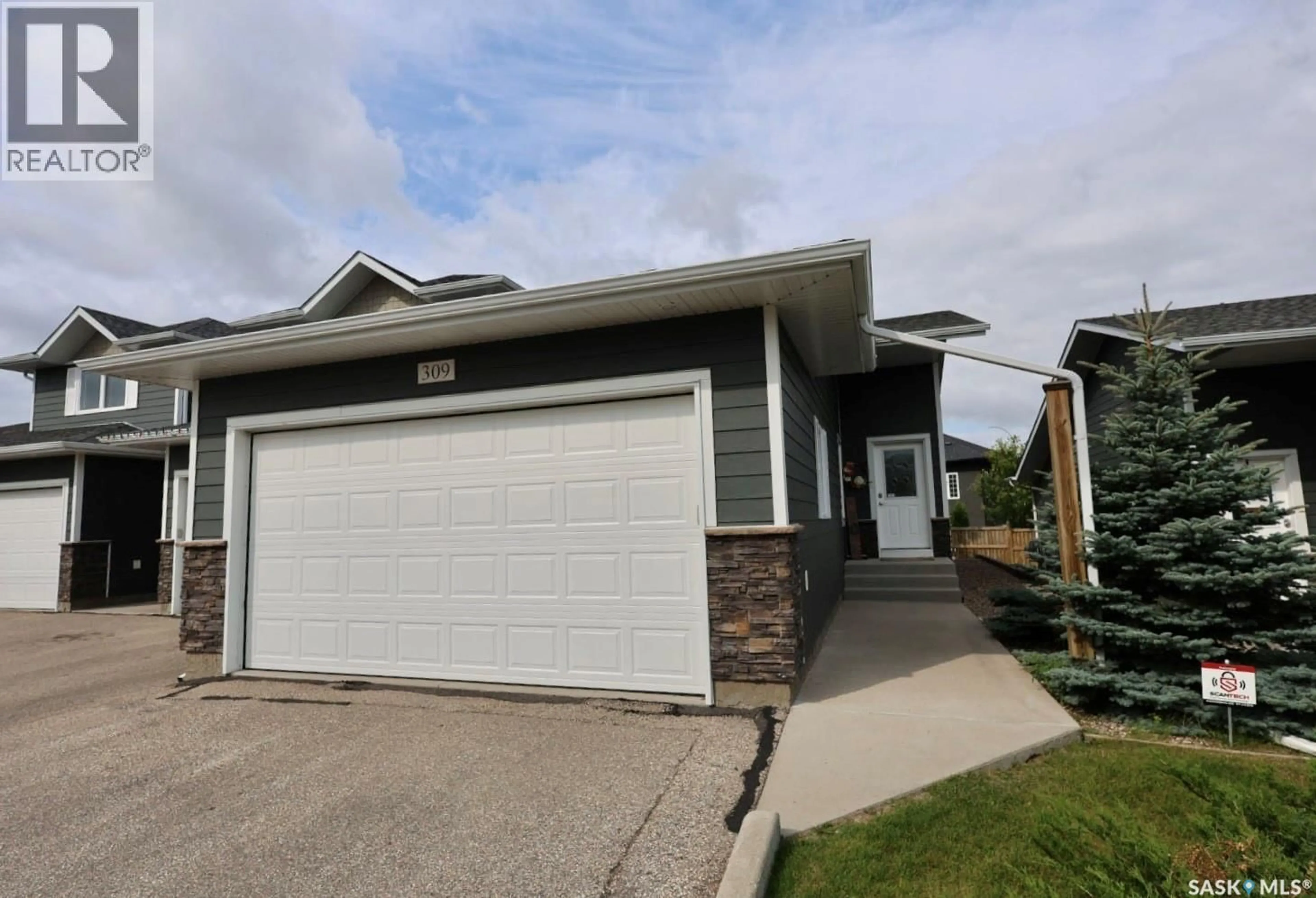 Home with vinyl exterior material, street for 1851 - 309 PEDERSON DRIVE, Prince Albert Saskatchewan S6X0B2