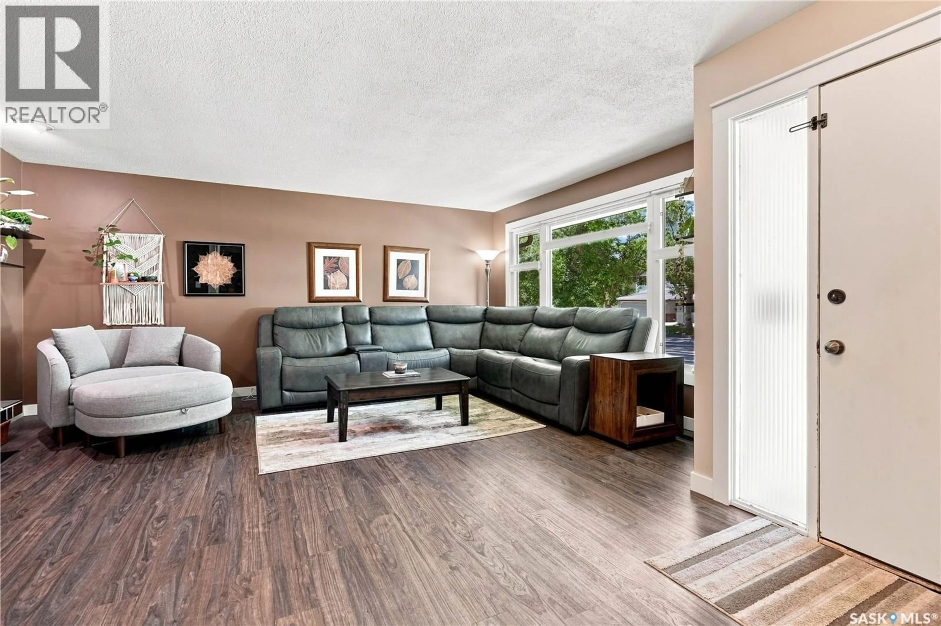 Living room with furniture, wood/laminate floor for 29 EVERETT CRESCENT, Regina Saskatchewan S4S2M8