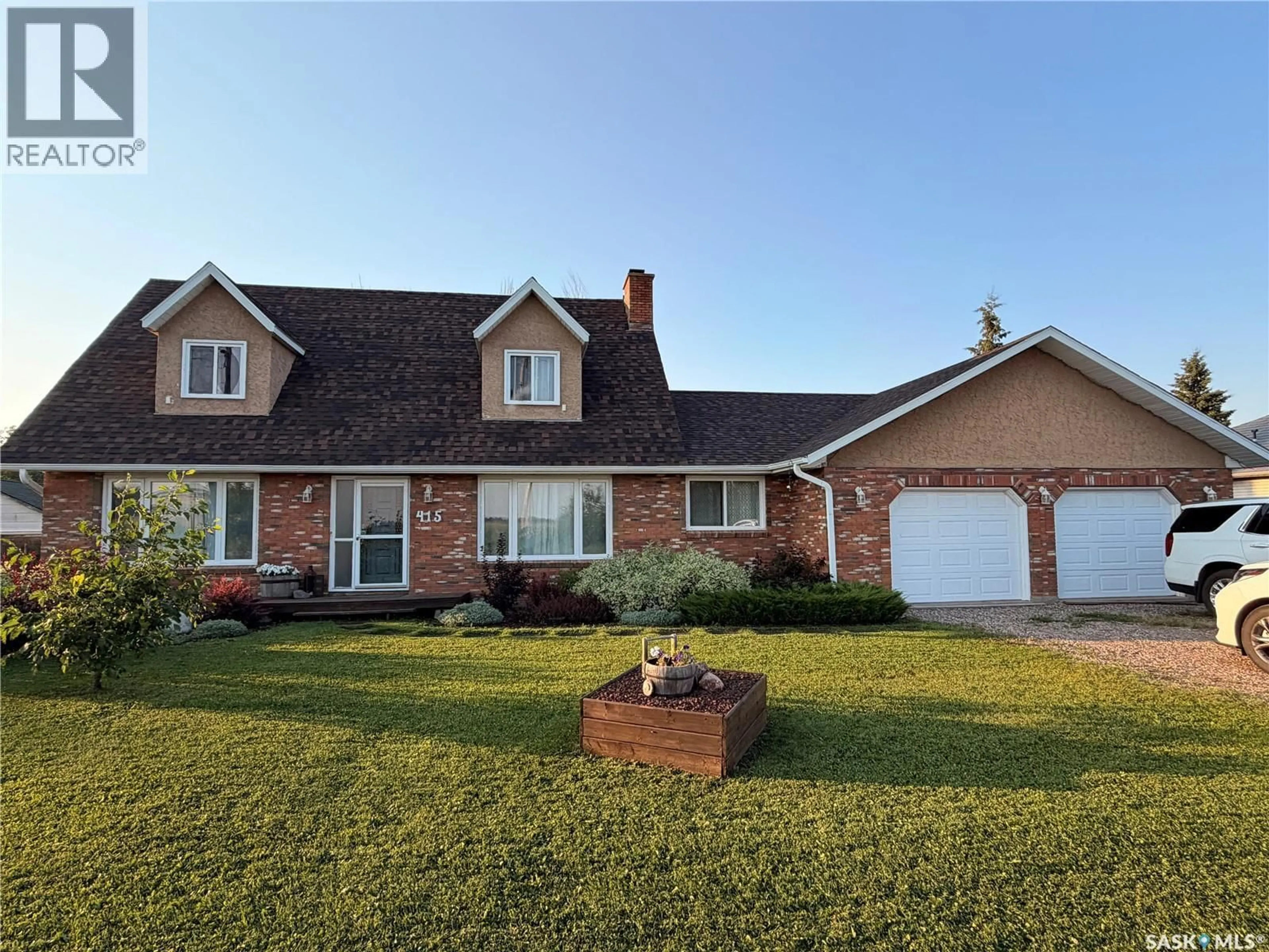 Home with brick exterior material, street for 415 9TH AVENUE, Meadow Lake Saskatchewan S9X1H1