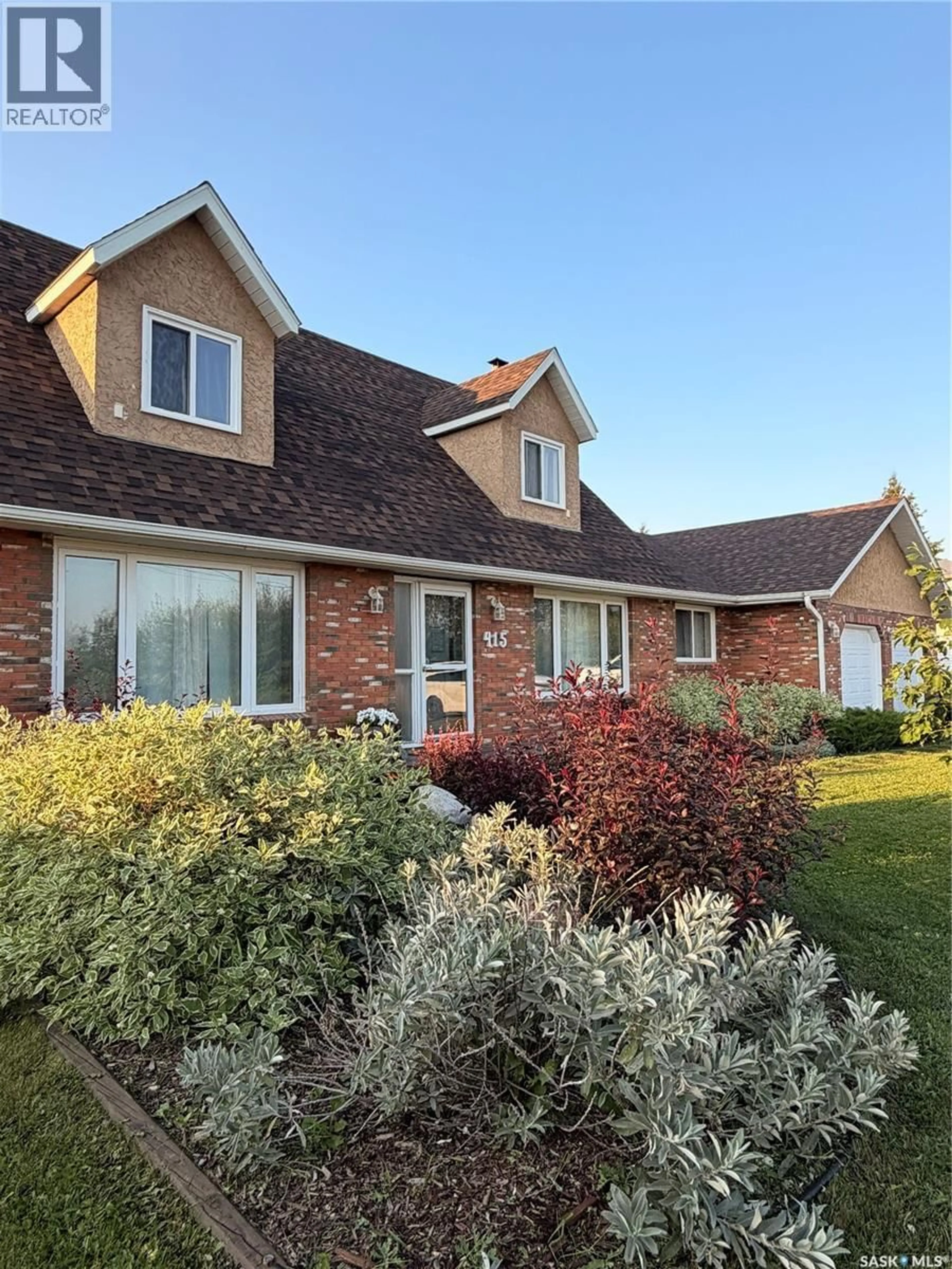 Home with brick exterior material, street for 415 9TH AVENUE, Meadow Lake Saskatchewan S9X1H1