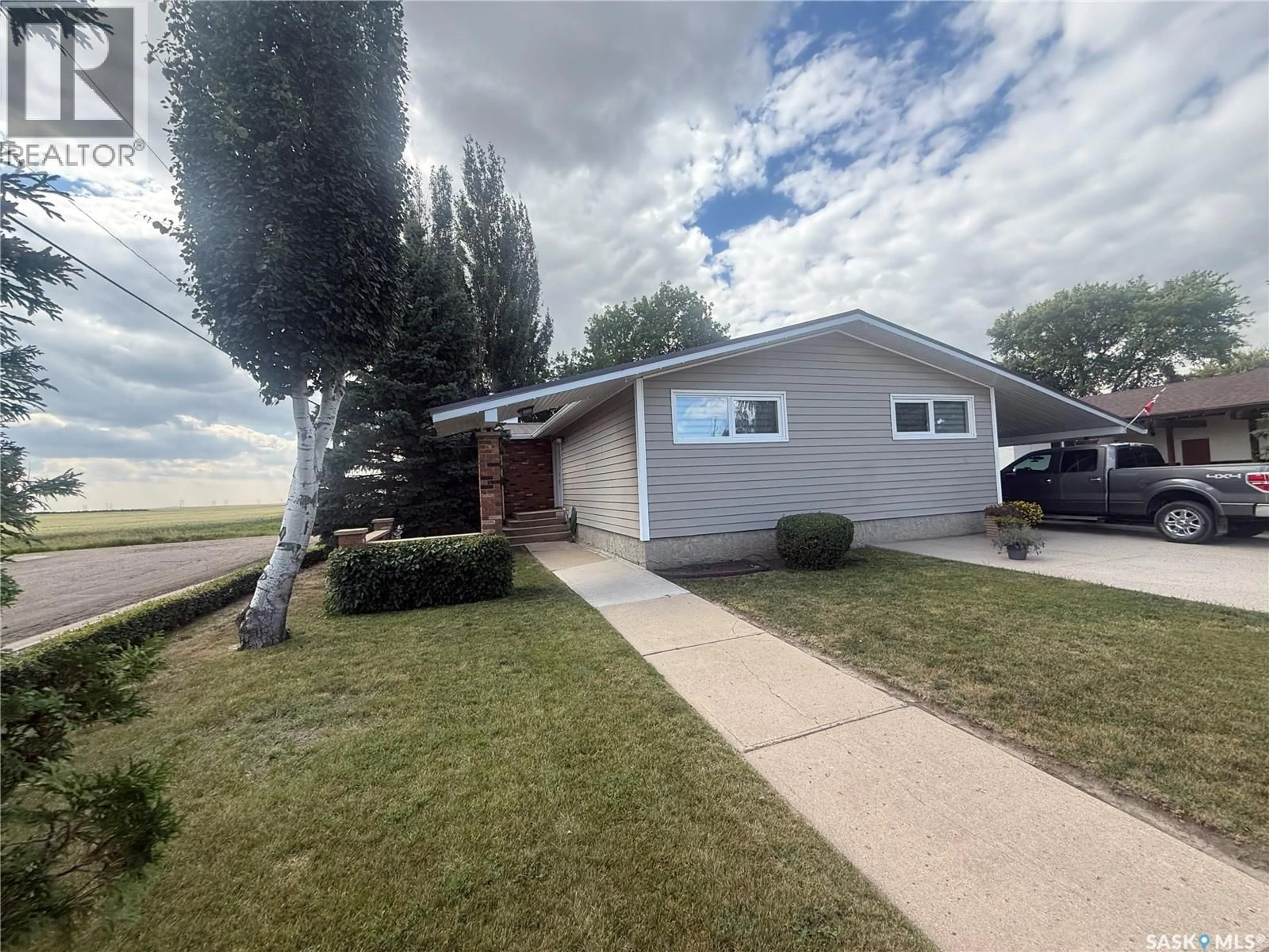 Home with vinyl exterior material, street for 66 KASPER CRESCENT, Assiniboia Saskatchewan S0H0B0