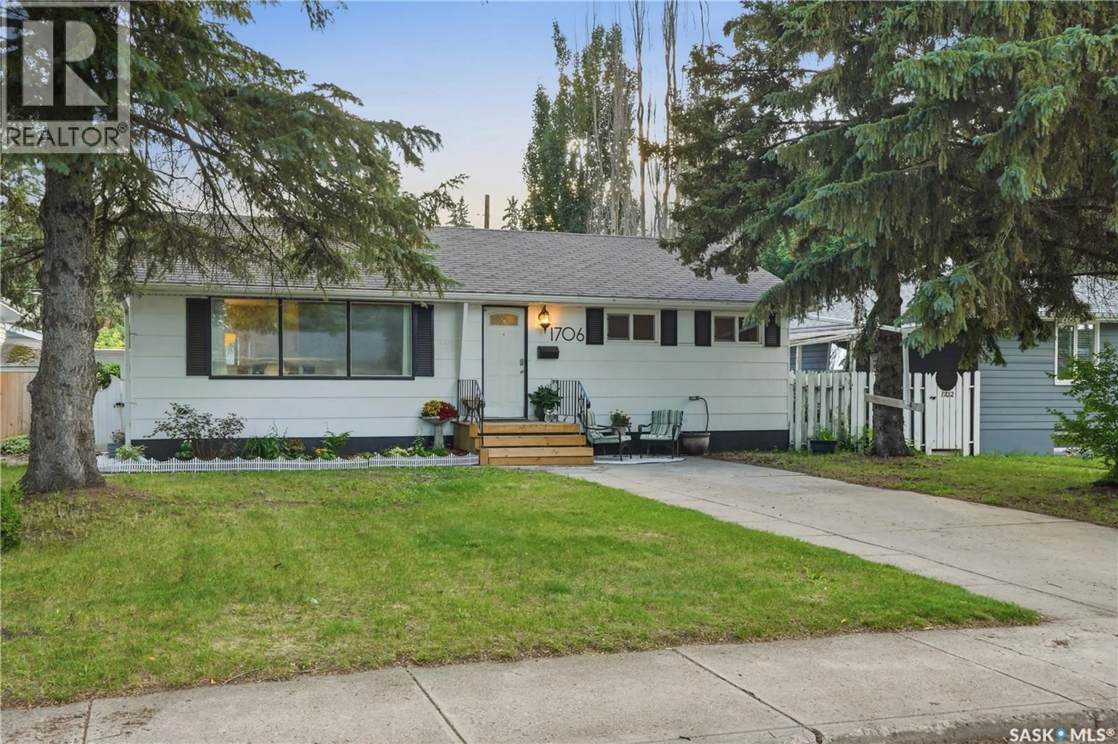 Home with vinyl exterior material, street for 1706 EWART AVENUE, Saskatoon Saskatchewan S7H2L2