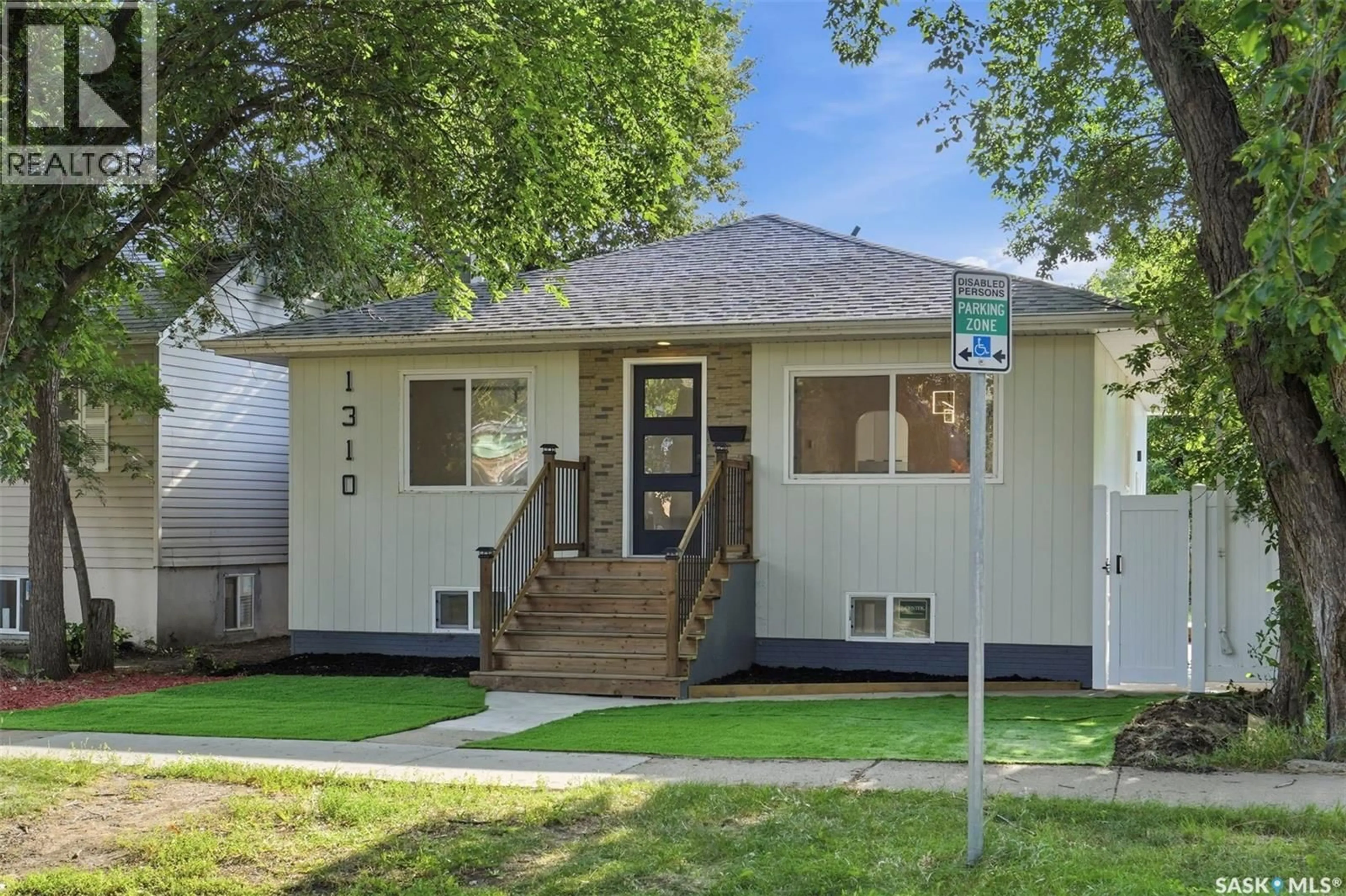Home with vinyl exterior material, street for 1310 B AVENUE, Saskatoon Saskatchewan S7L1G5