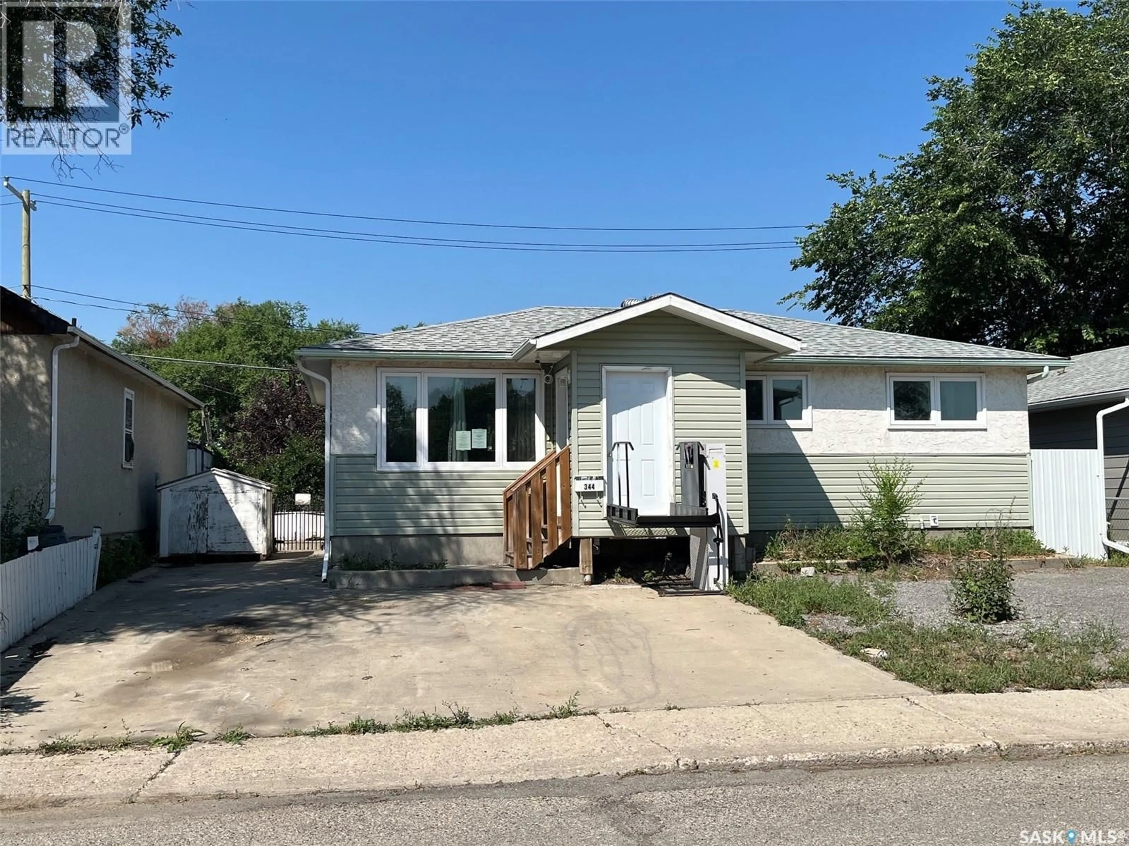 Home with vinyl exterior material, street for 344 WASCANA STREET, Regina Saskatchewan S4R4H9