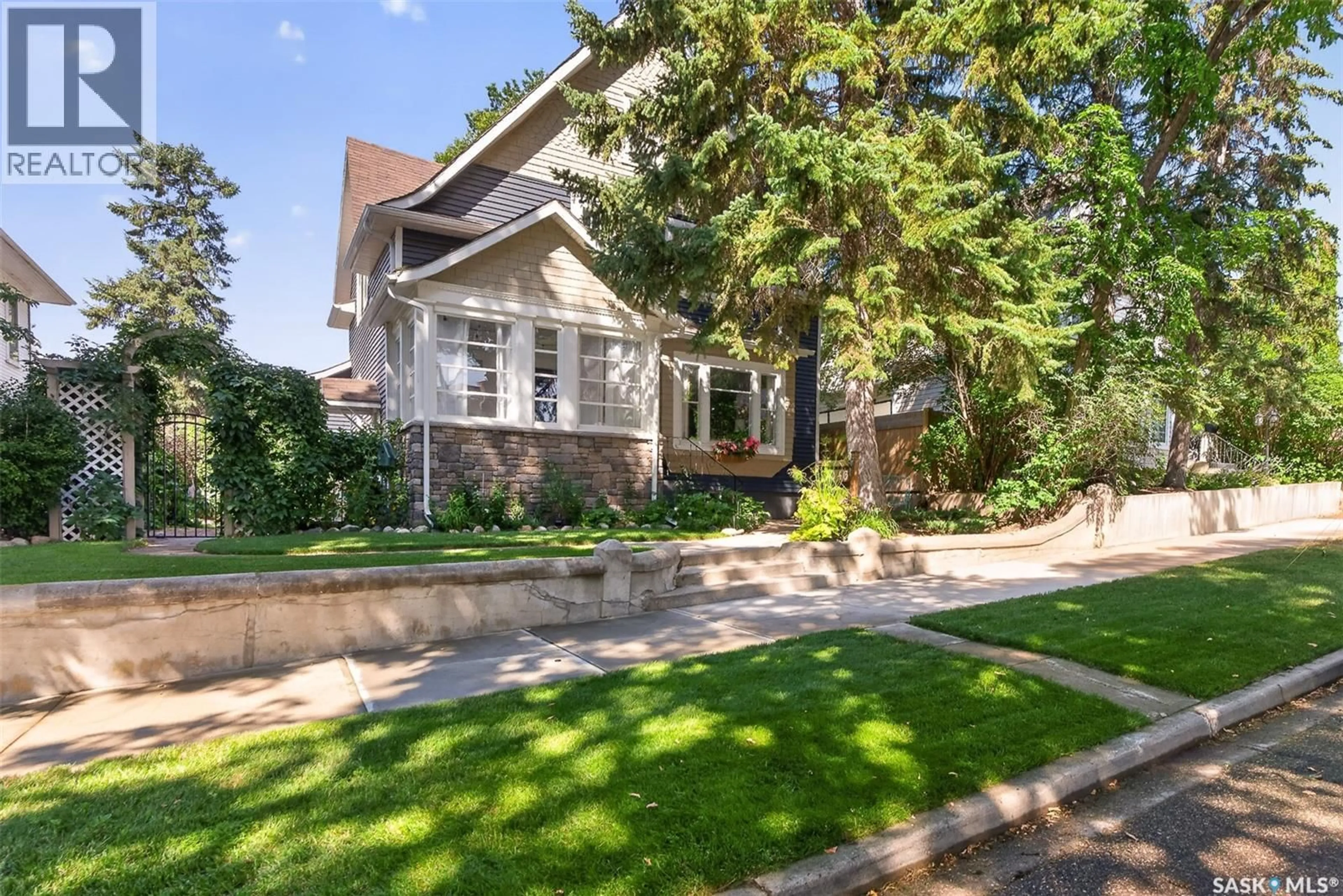 Home with brick exterior material, street for 1046 CLIFTON AVENUE, Moose Jaw Saskatchewan S6H3L2
