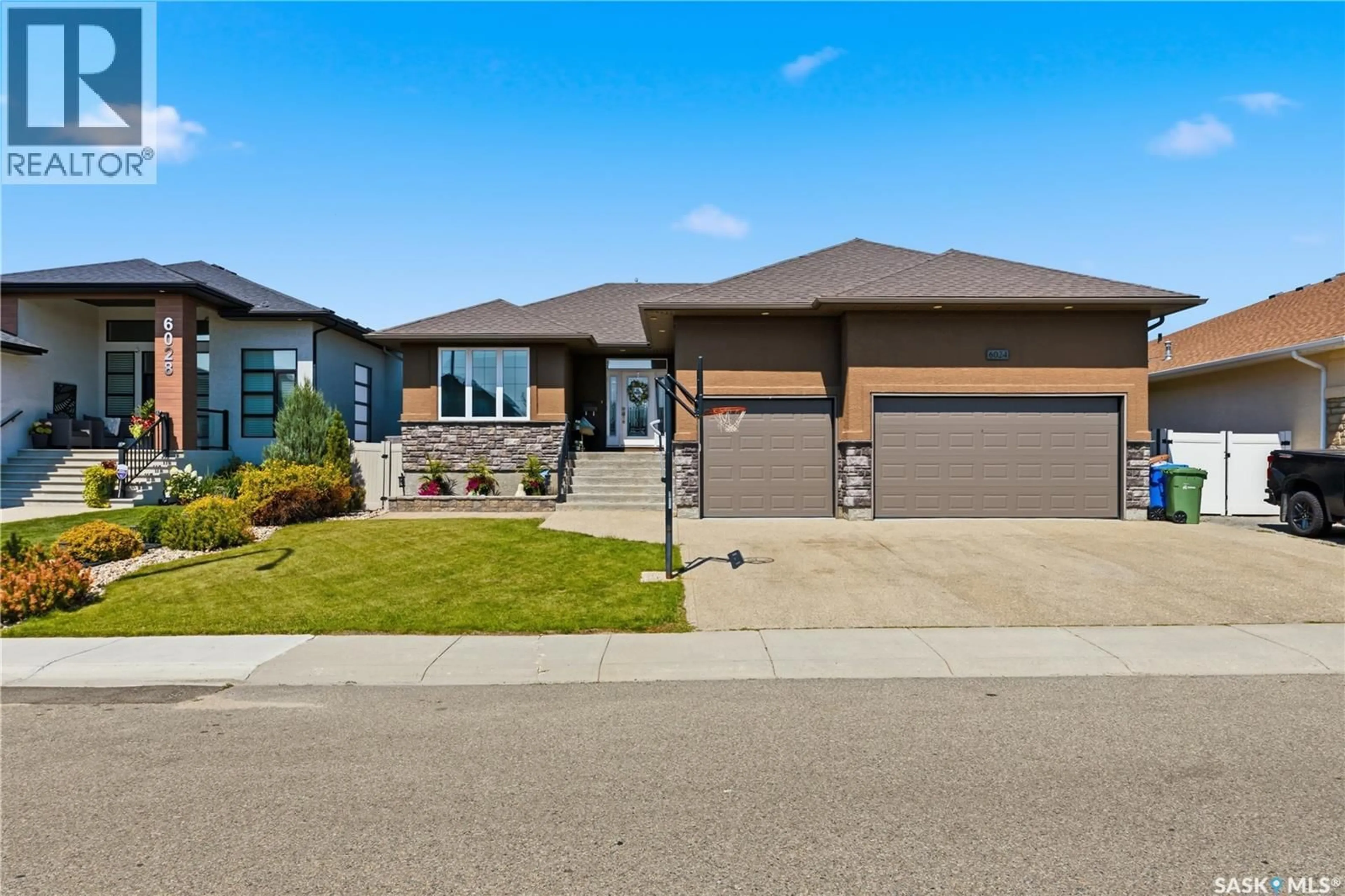 Home with brick exterior material, street for 6024 LITTLE PINE LOOP, Regina Saskatchewan S4X0H5