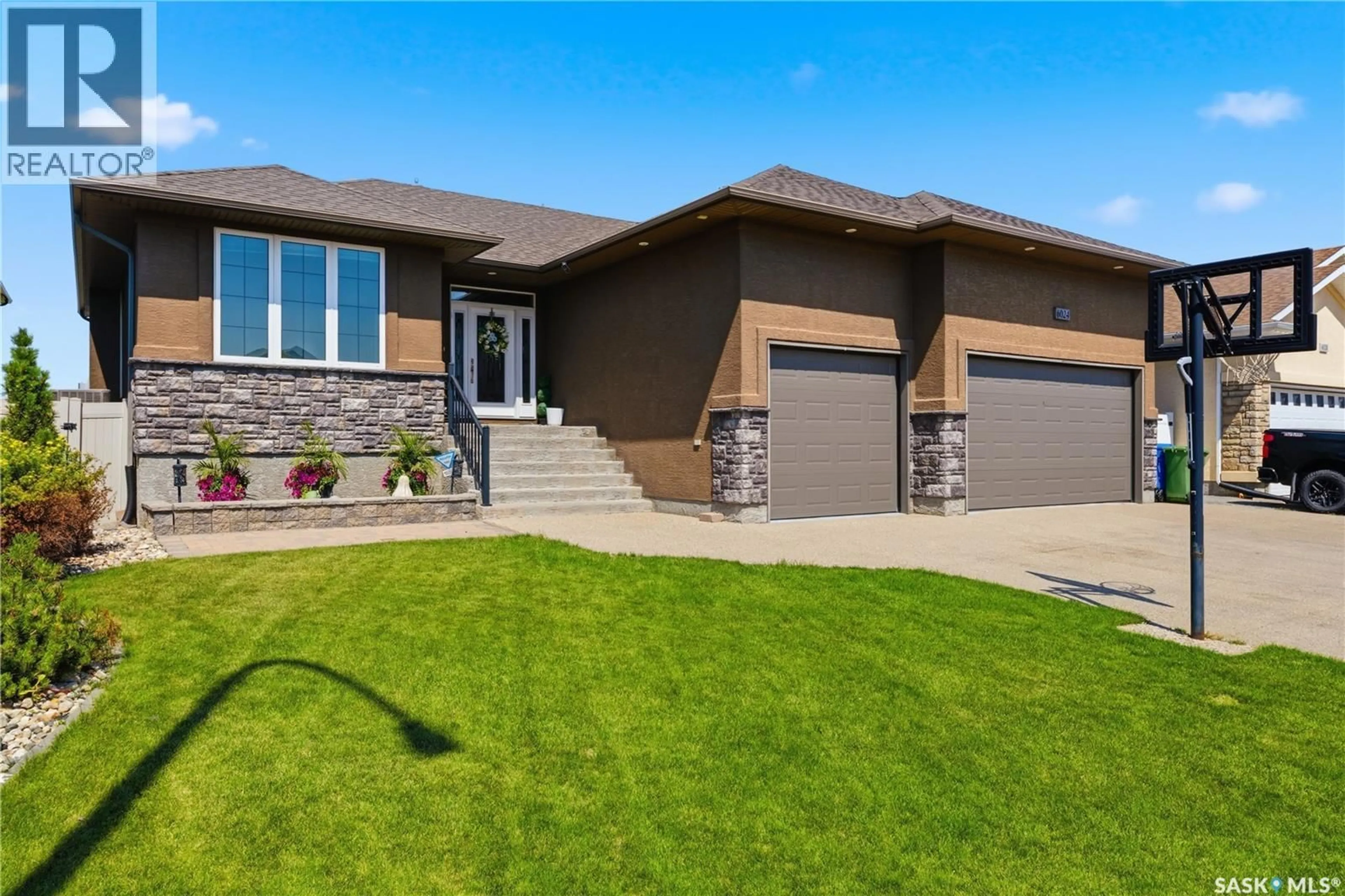 Home with brick exterior material, street for 6024 LITTLE PINE LOOP, Regina Saskatchewan S4X0H5