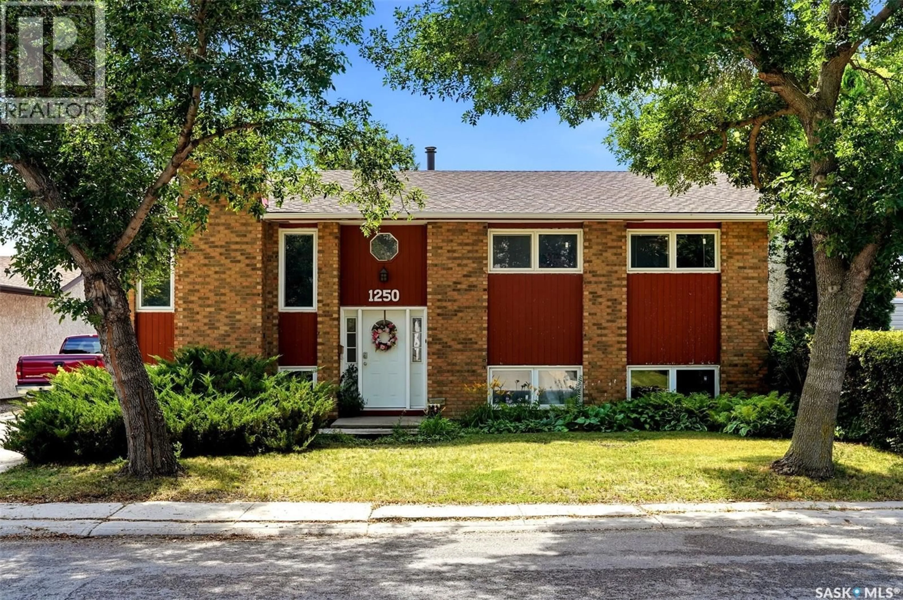 Home with brick exterior material, street for 1250 MCNEILL CRESCENT, Regina Saskatchewan S4N5Z4