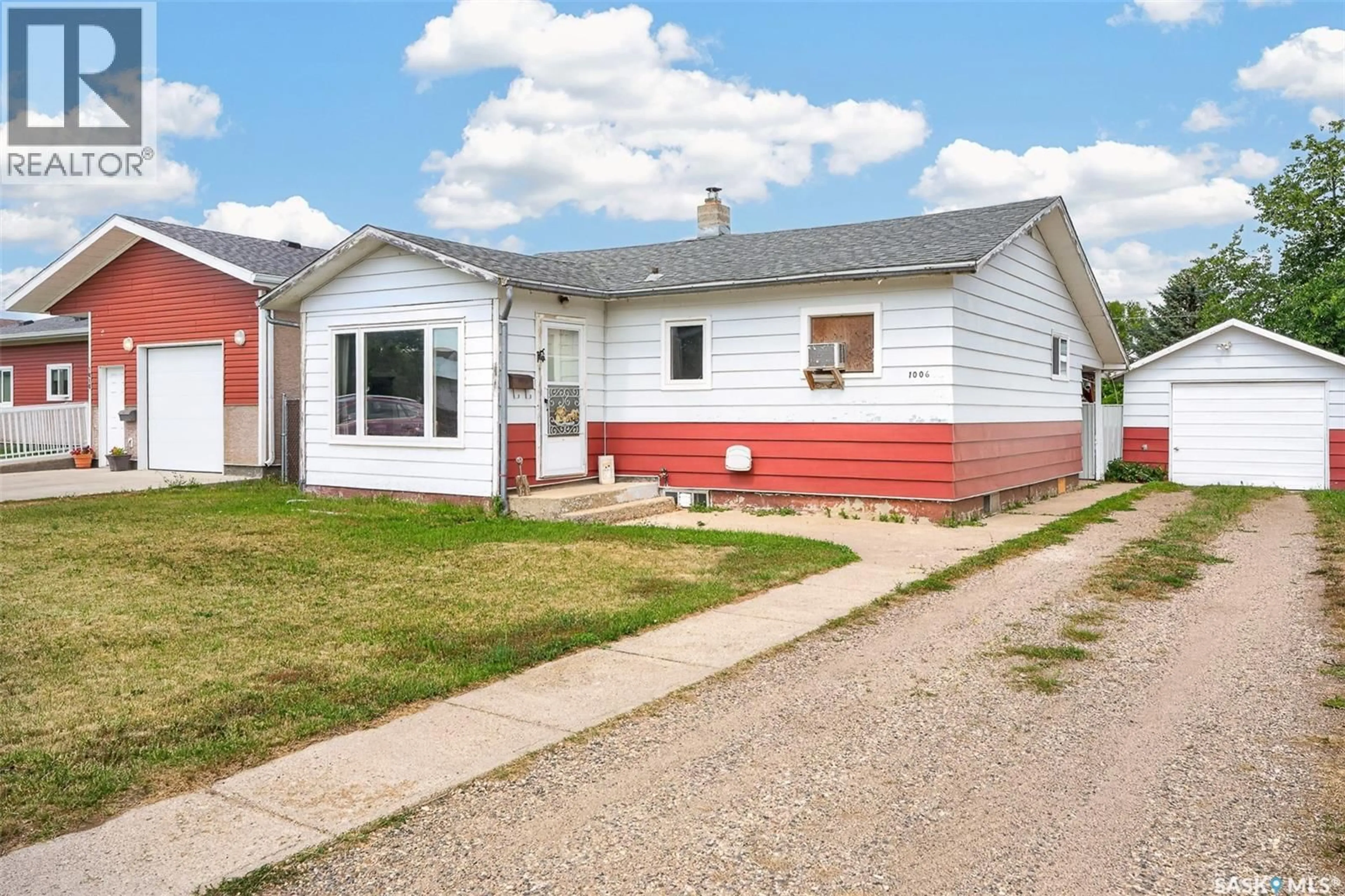 Home with vinyl exterior material, street for 1006 WARNER STREET, Moose Jaw Saskatchewan S6H5S5