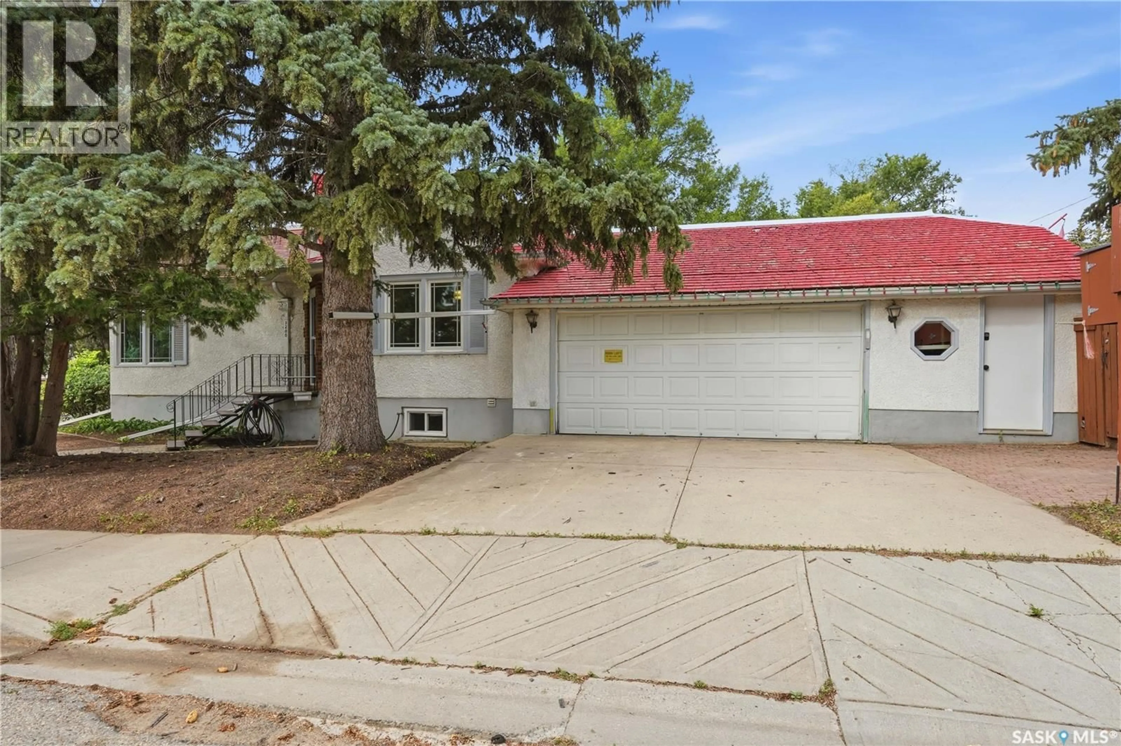 Home with vinyl exterior material, street for 3200 COLLEGE AVENUE, Regina Saskatchewan S4T1V9