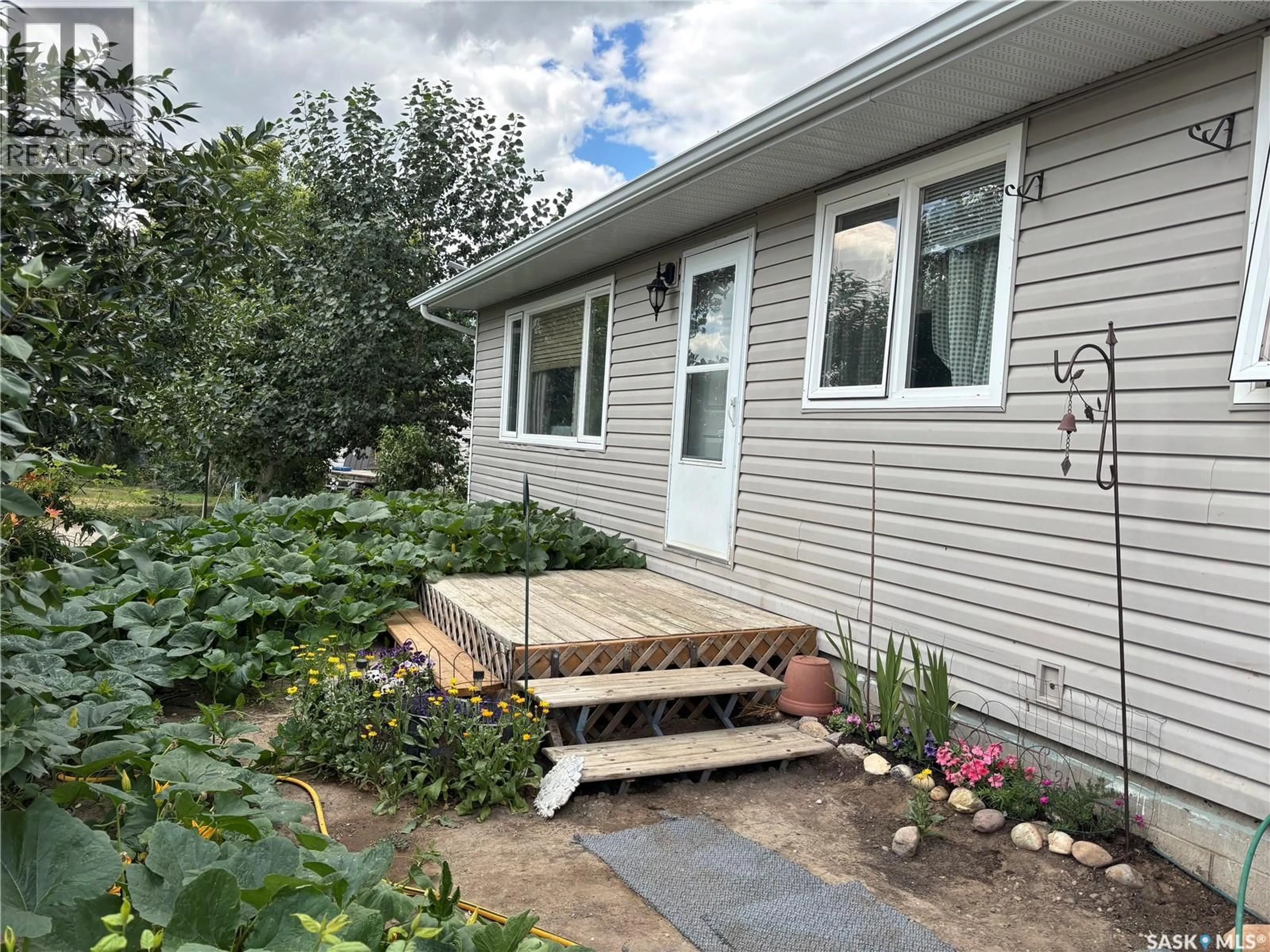 Home with vinyl exterior material, street for WELSH ACREAGE, Excelsior Rm No. 166 Saskatchewan S0H4J0