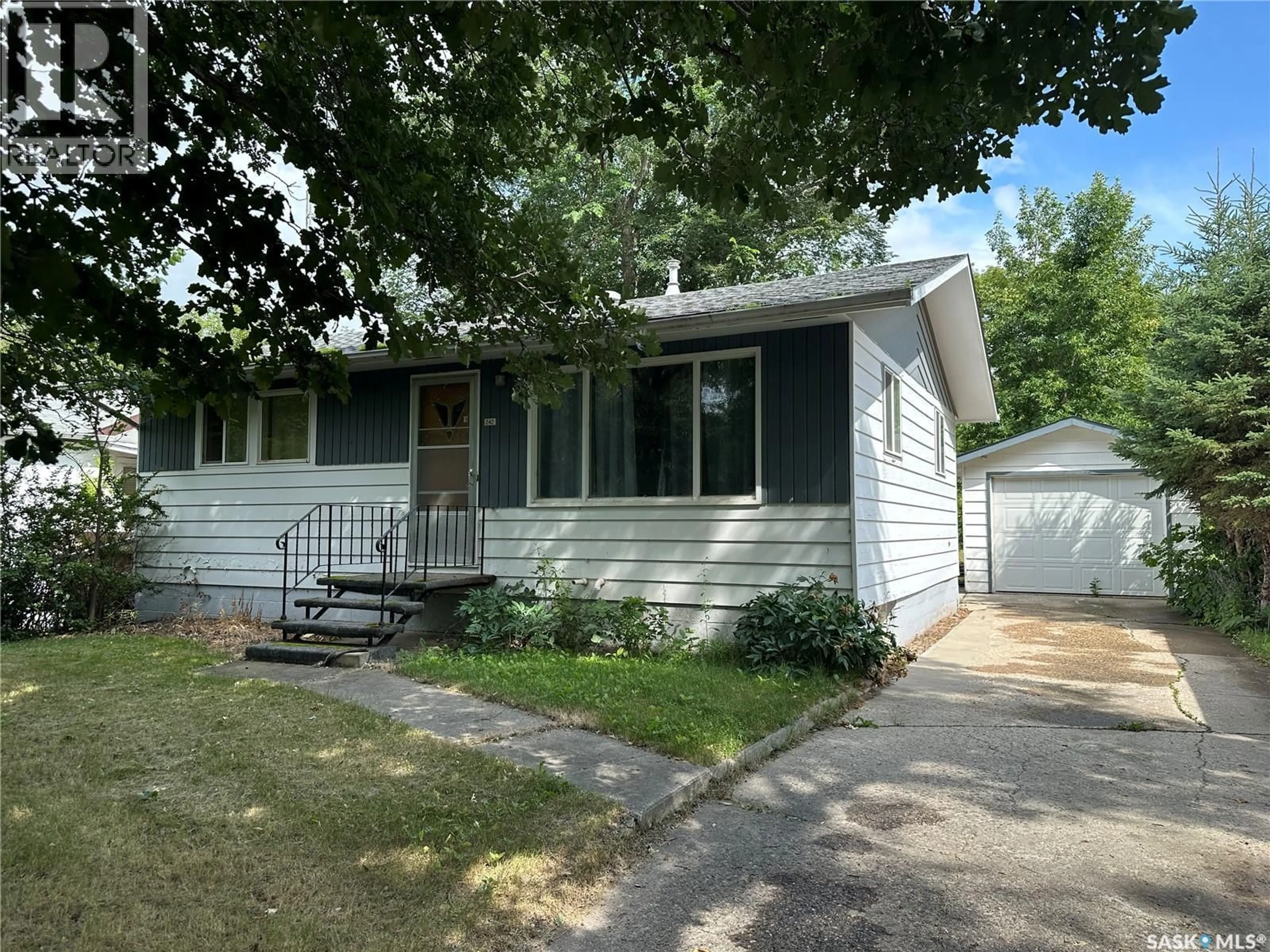 Home with vinyl exterior material, street for 242 THIRD AVENUE, Kamsack Saskatchewan S0A1S0