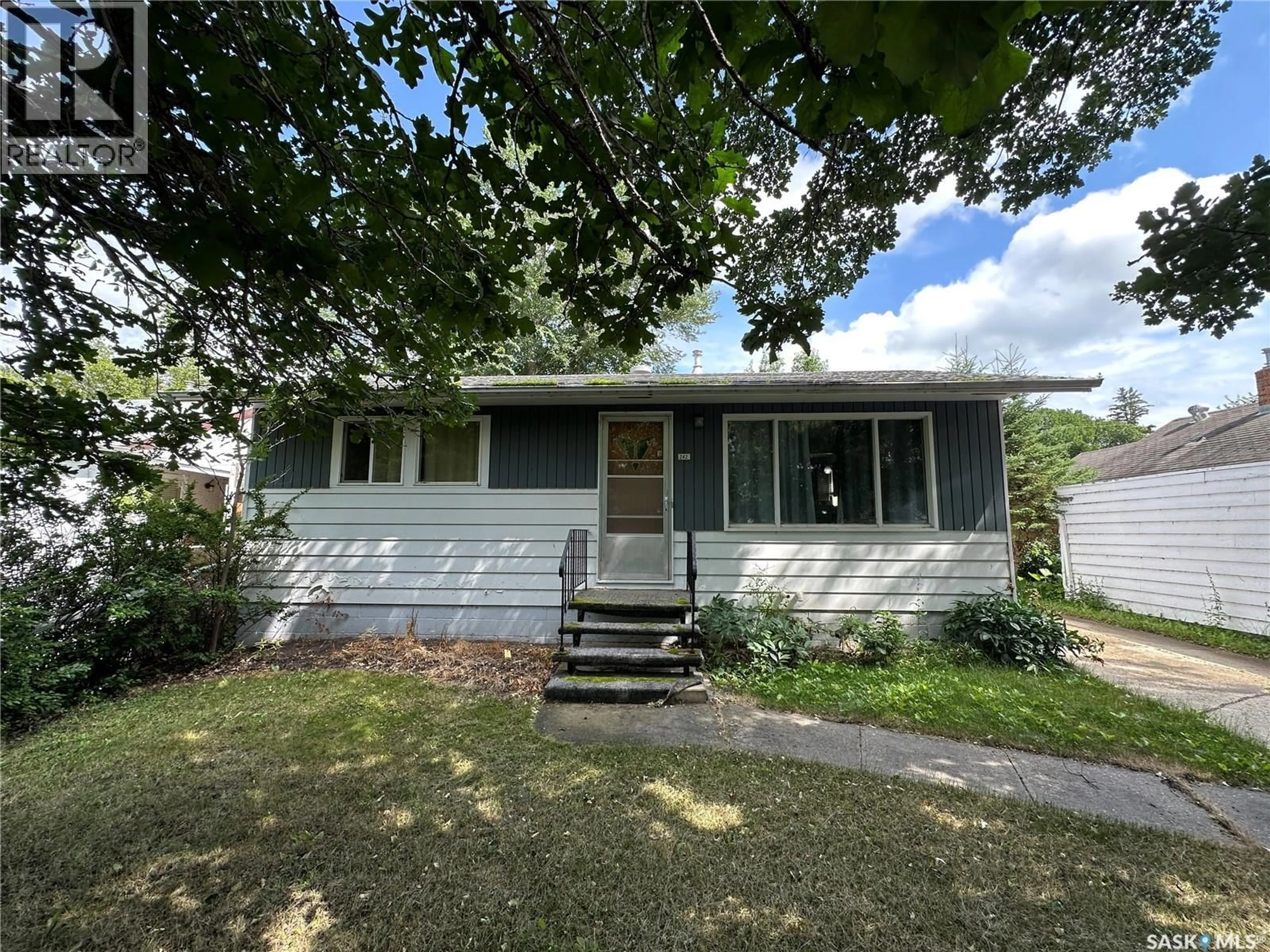 Home with vinyl exterior material, street for 242 THIRD AVENUE, Kamsack Saskatchewan S0A1S0
