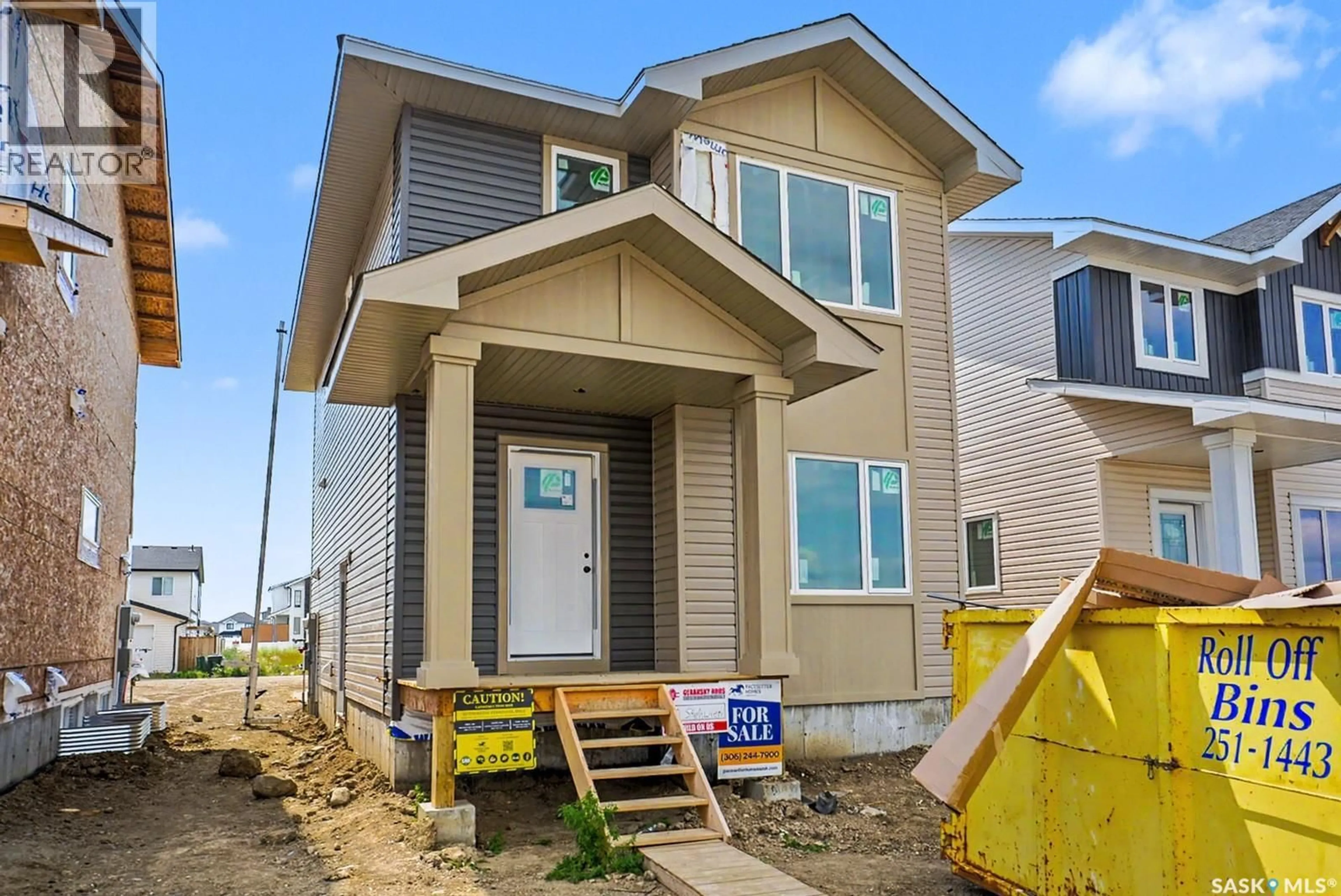 Home with vinyl exterior material, street for 414 STEHWIEN STREET, Saskatoon Saskatchewan S7W1M9