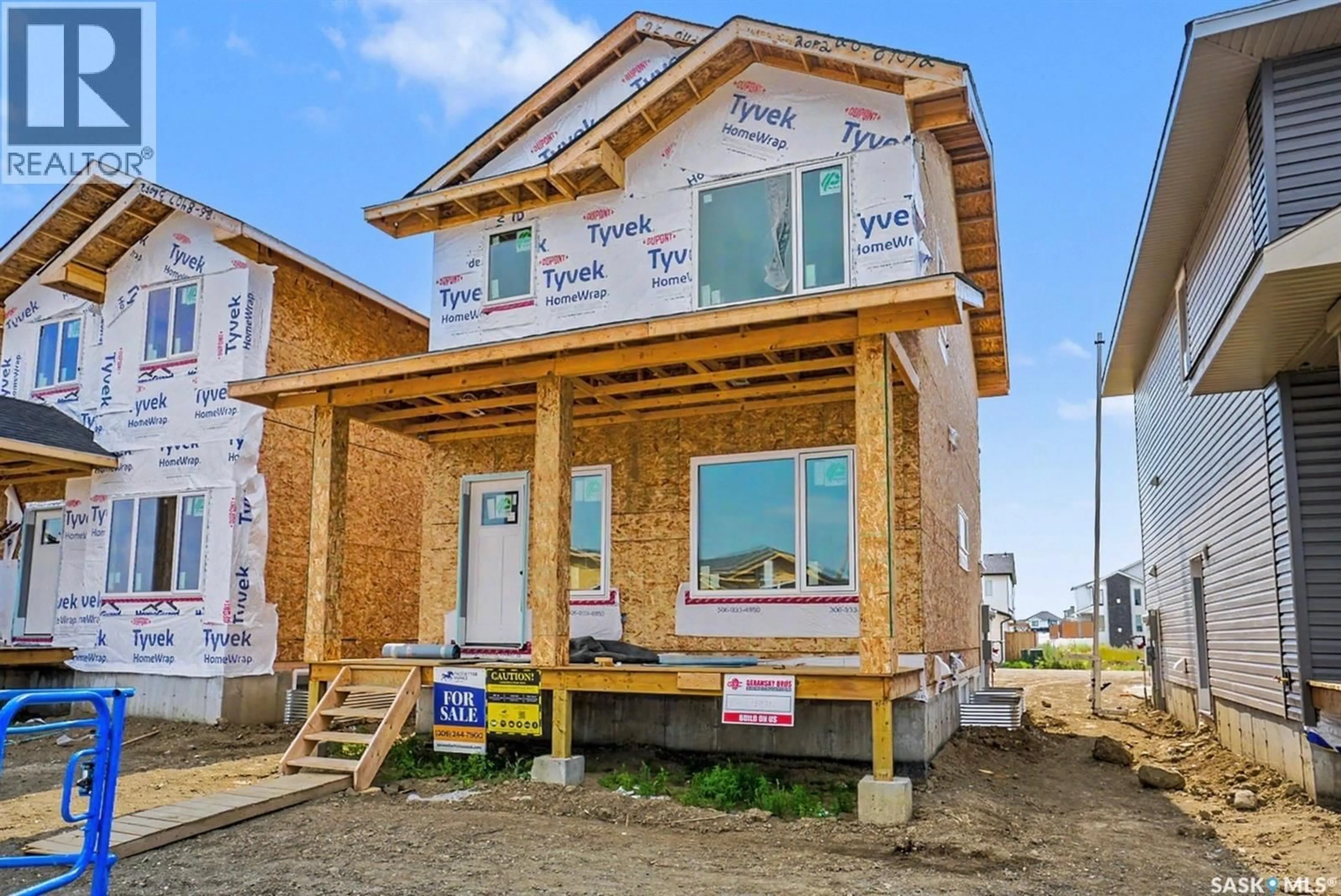 Home with vinyl exterior material, building for 410 STEHWIEN STREET, Saskatoon Saskatchewan S7W1M9