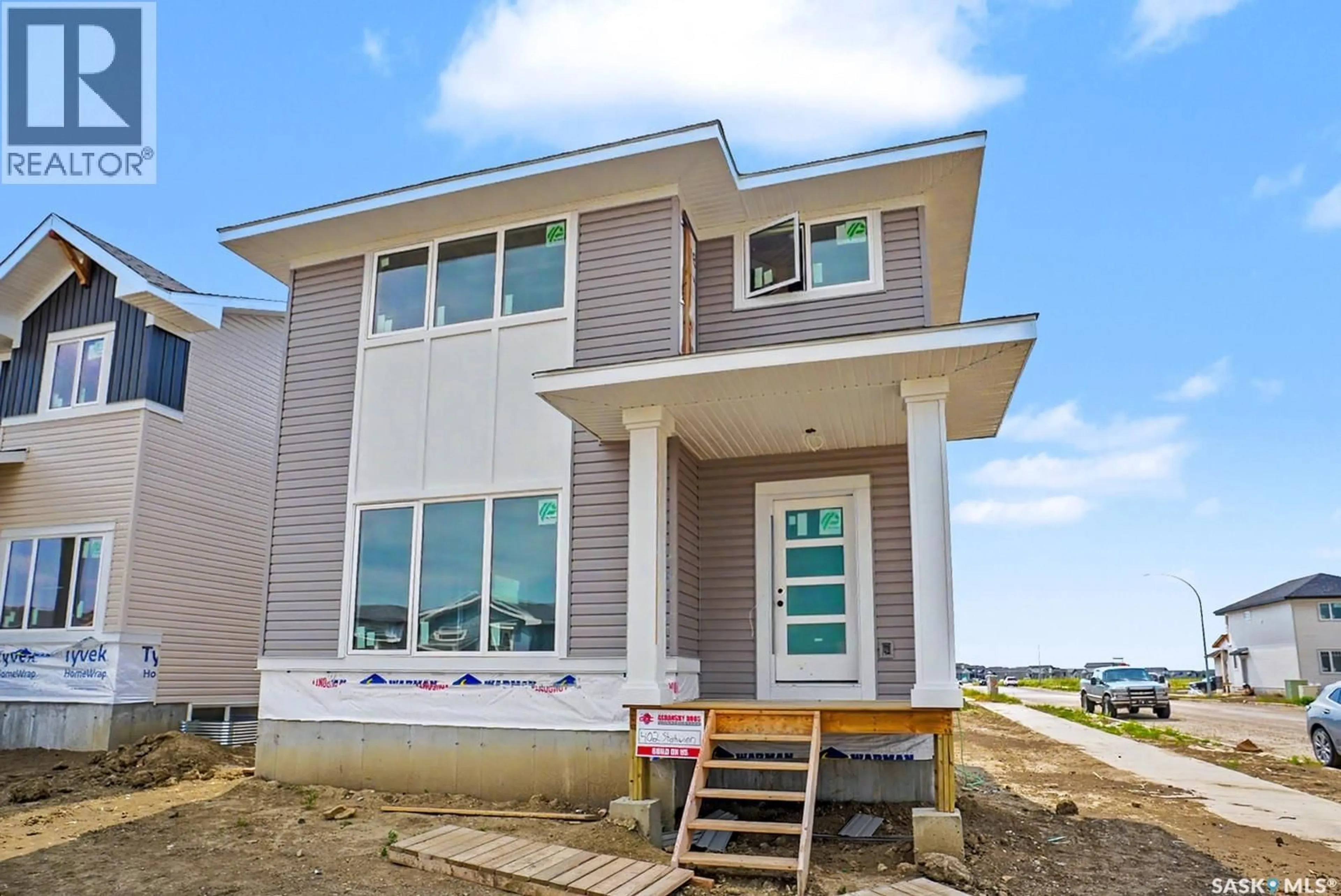 Home with vinyl exterior material, building for 402 STEHWIEN STREET, Saskatoon Saskatchewan S7W1H5