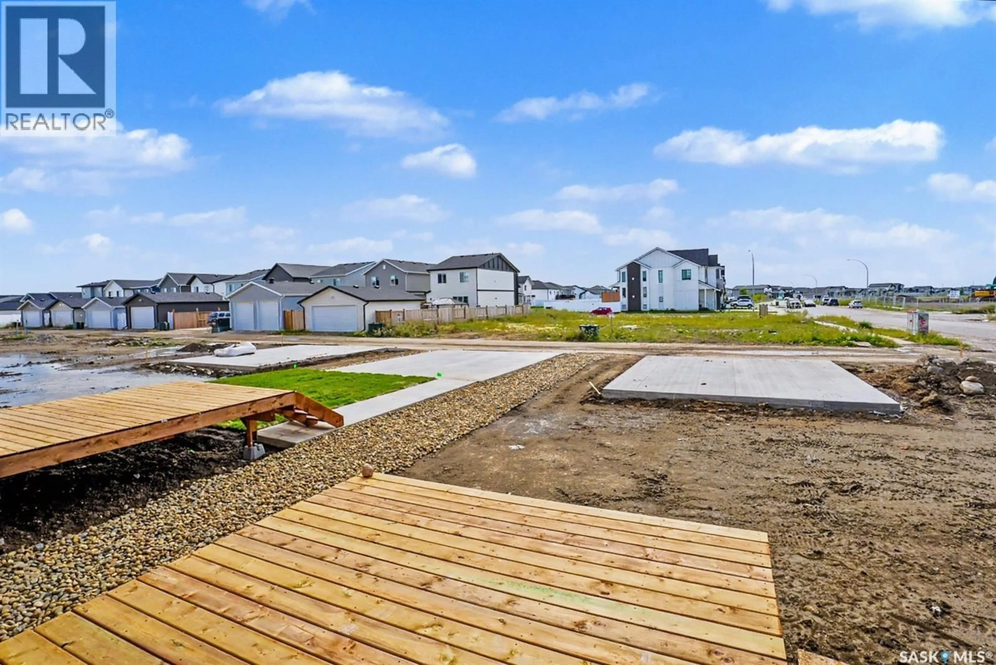 A pic from outside/outdoor area/front of a property/back of a property/a pic from drone, water/lake/river/ocean view for 402 STEHWIEN STREET, Saskatoon Saskatchewan S7W1H5