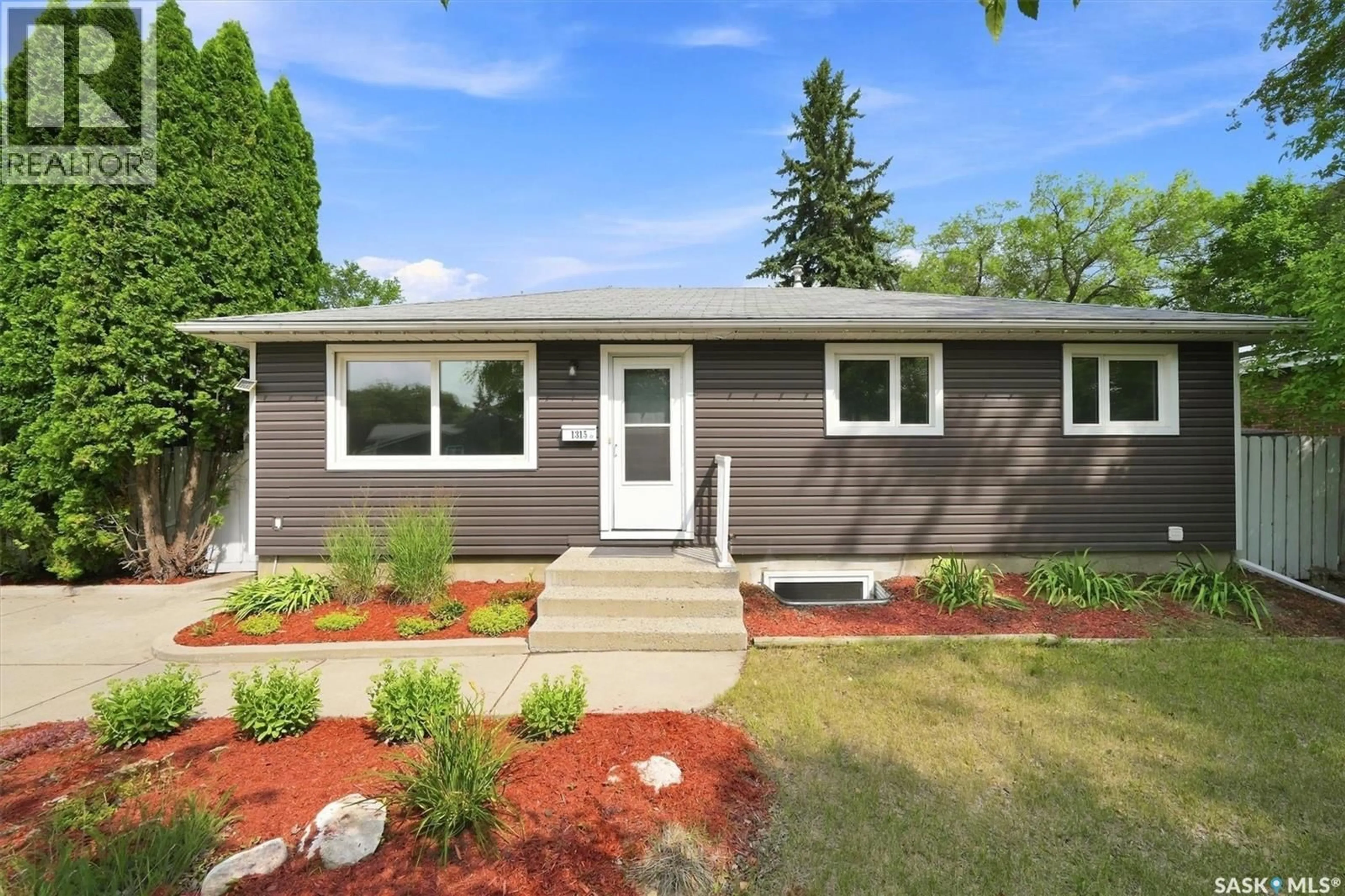 Home with vinyl exterior material, street for 1315 WILSON CRESCENT, Saskatoon Saskatchewan S7J3J8