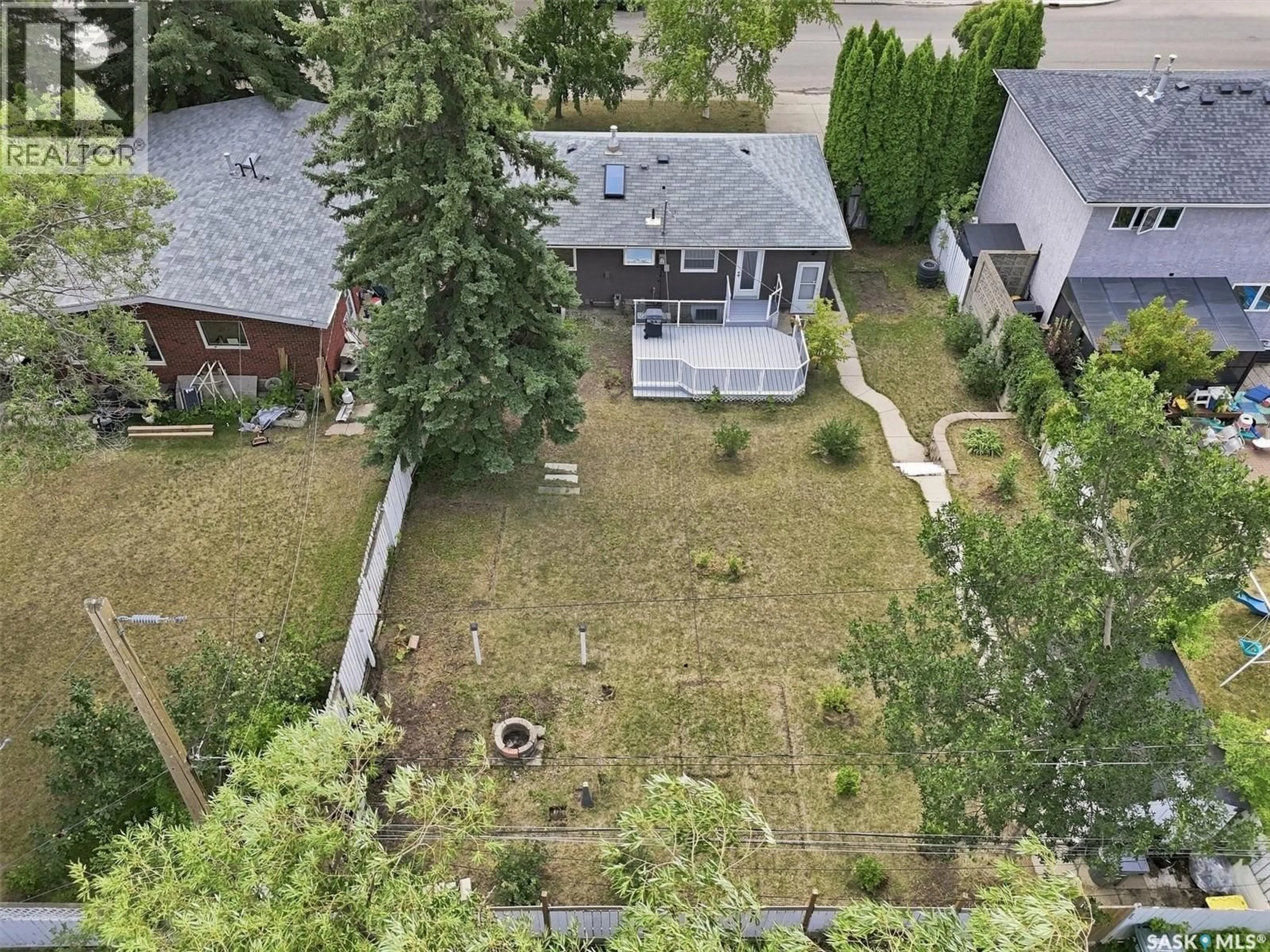 A pic from outside/outdoor area/front of a property/back of a property/a pic from drone, street for 1315 WILSON CRESCENT, Saskatoon Saskatchewan S7J3J8