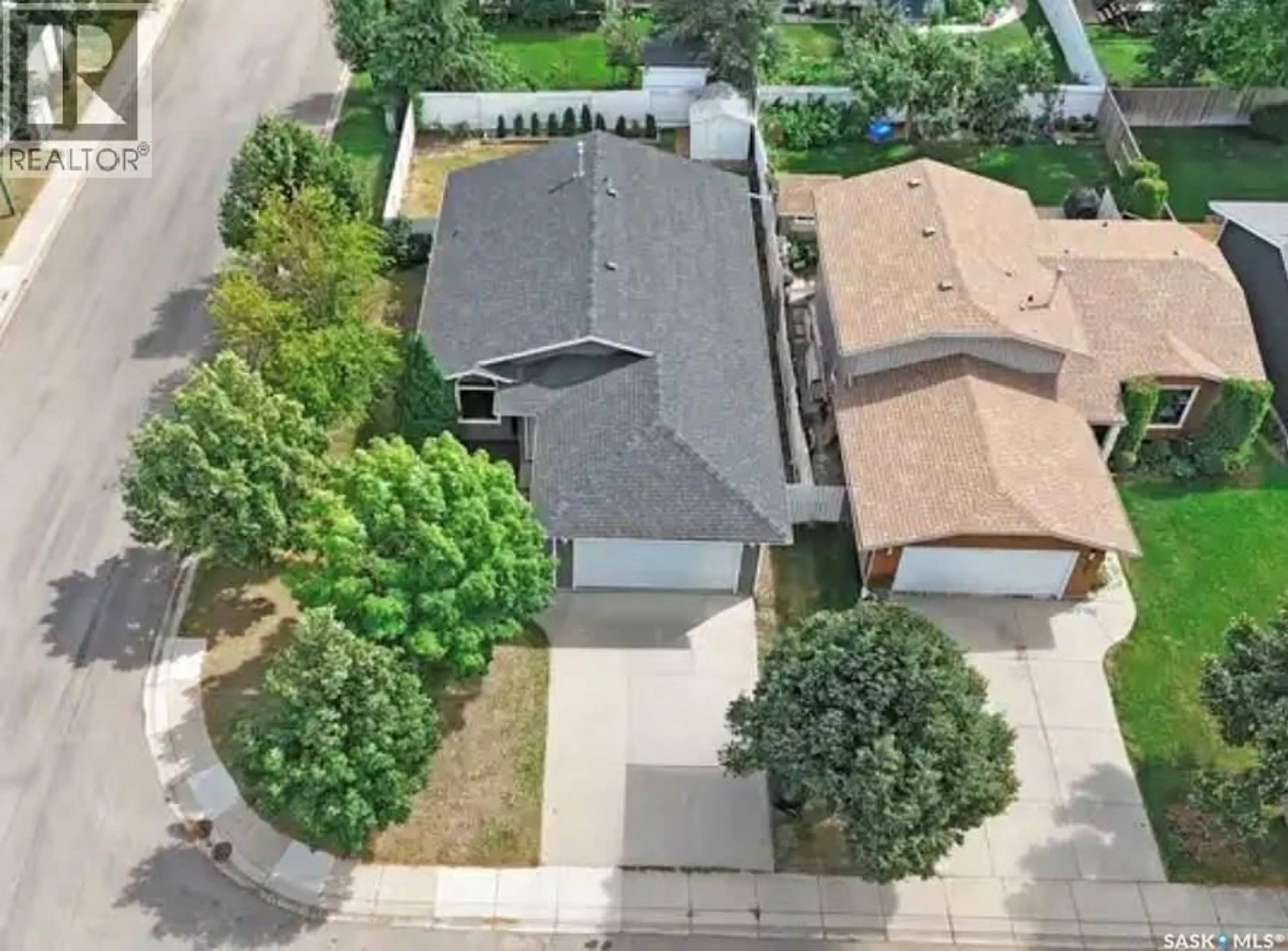 A pic from outside/outdoor area/front of a property/back of a property/a pic from drone, street for 303 HASLAM CRESCENT, Saskatoon Saskatchewan S7S1E4