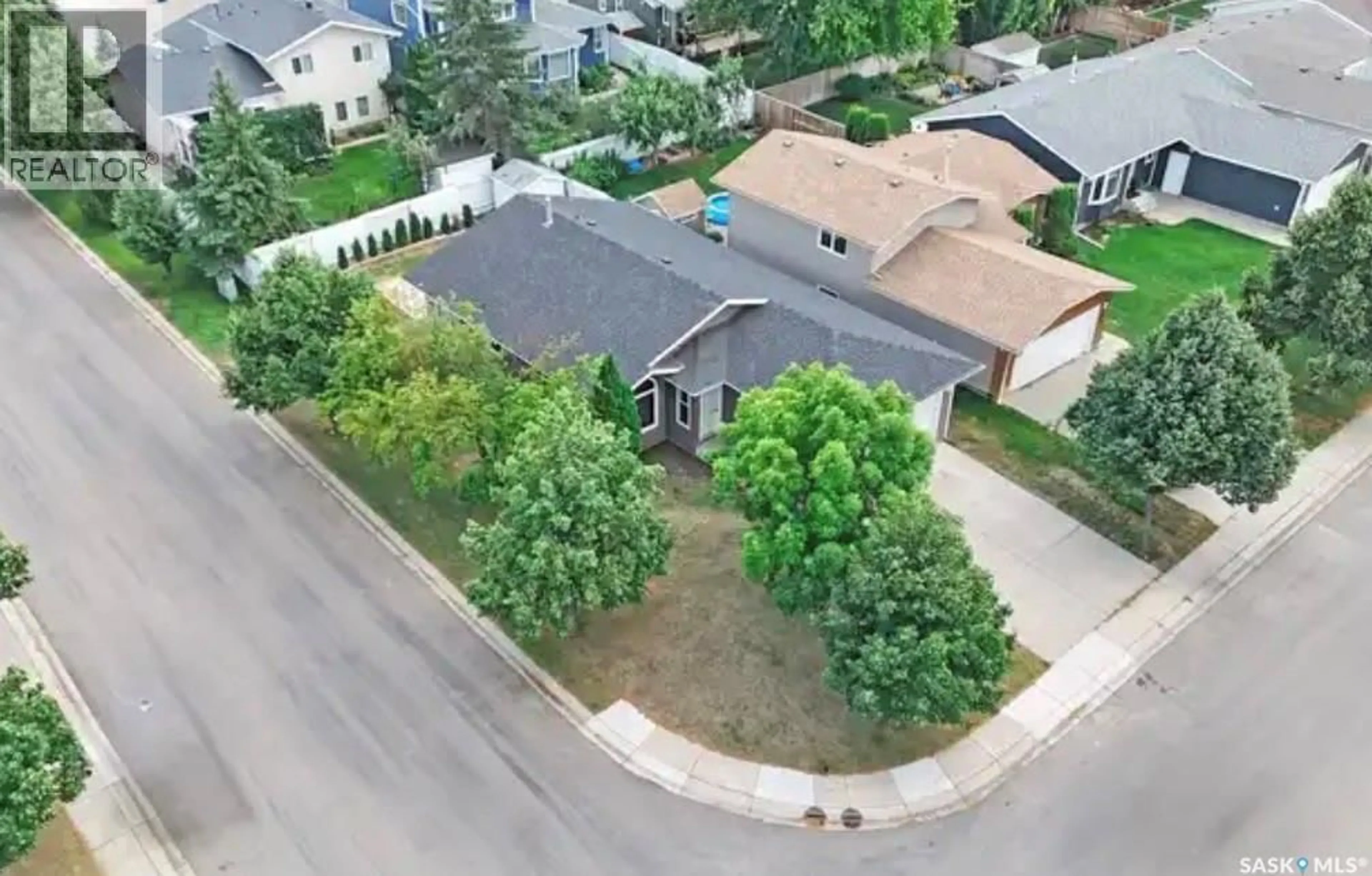 A pic from outside/outdoor area/front of a property/back of a property/a pic from drone, street for 303 HASLAM CRESCENT, Saskatoon Saskatchewan S7S1E4